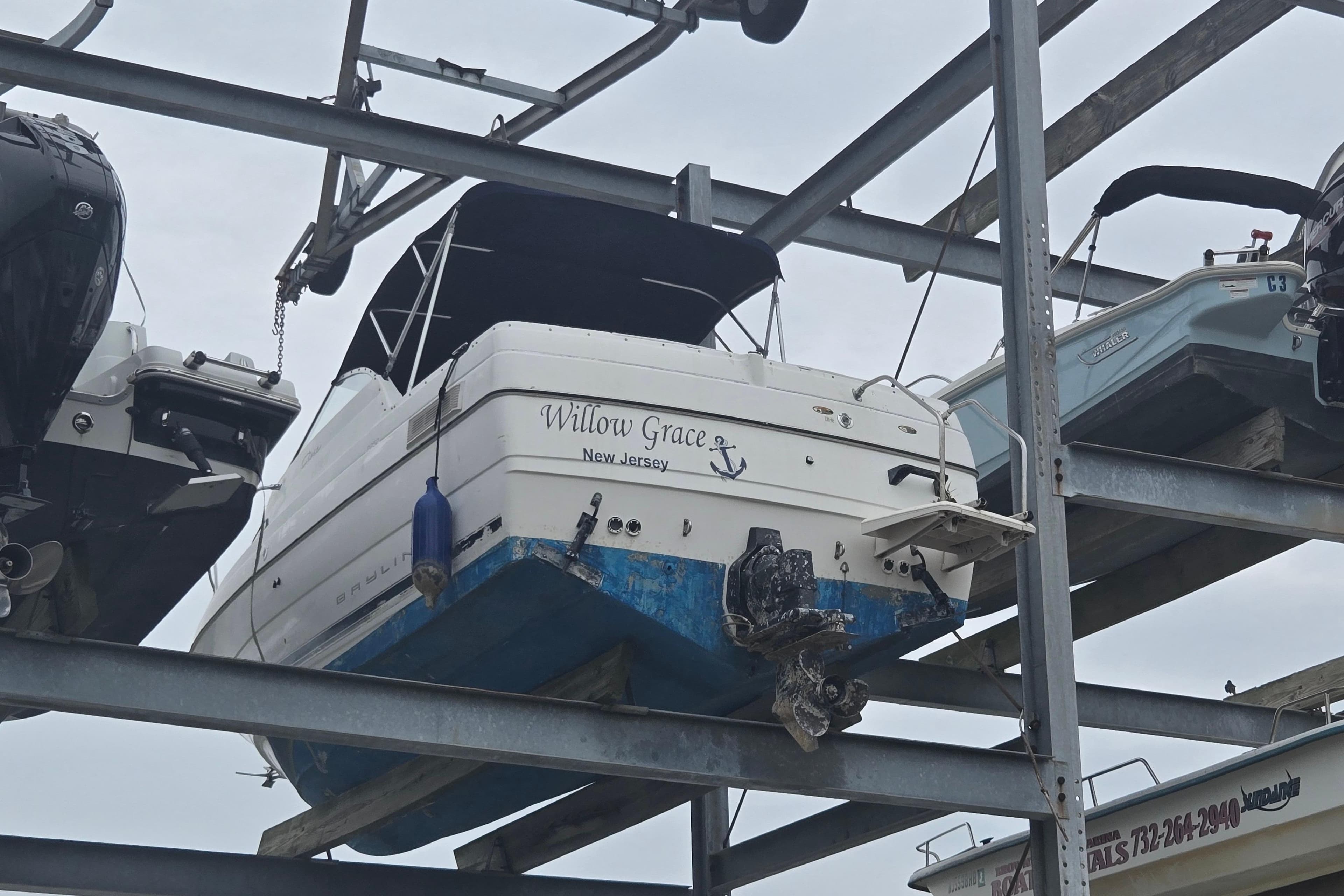Bayliner 2252 Ciera Express 2000 boat stored on elevated rack in New Jersey marina.