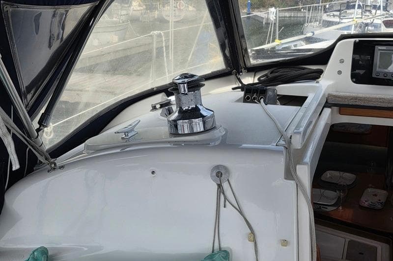 Interior view of a 1996 Hunter 336 sailboat cockpit with winch and navigation equipment.