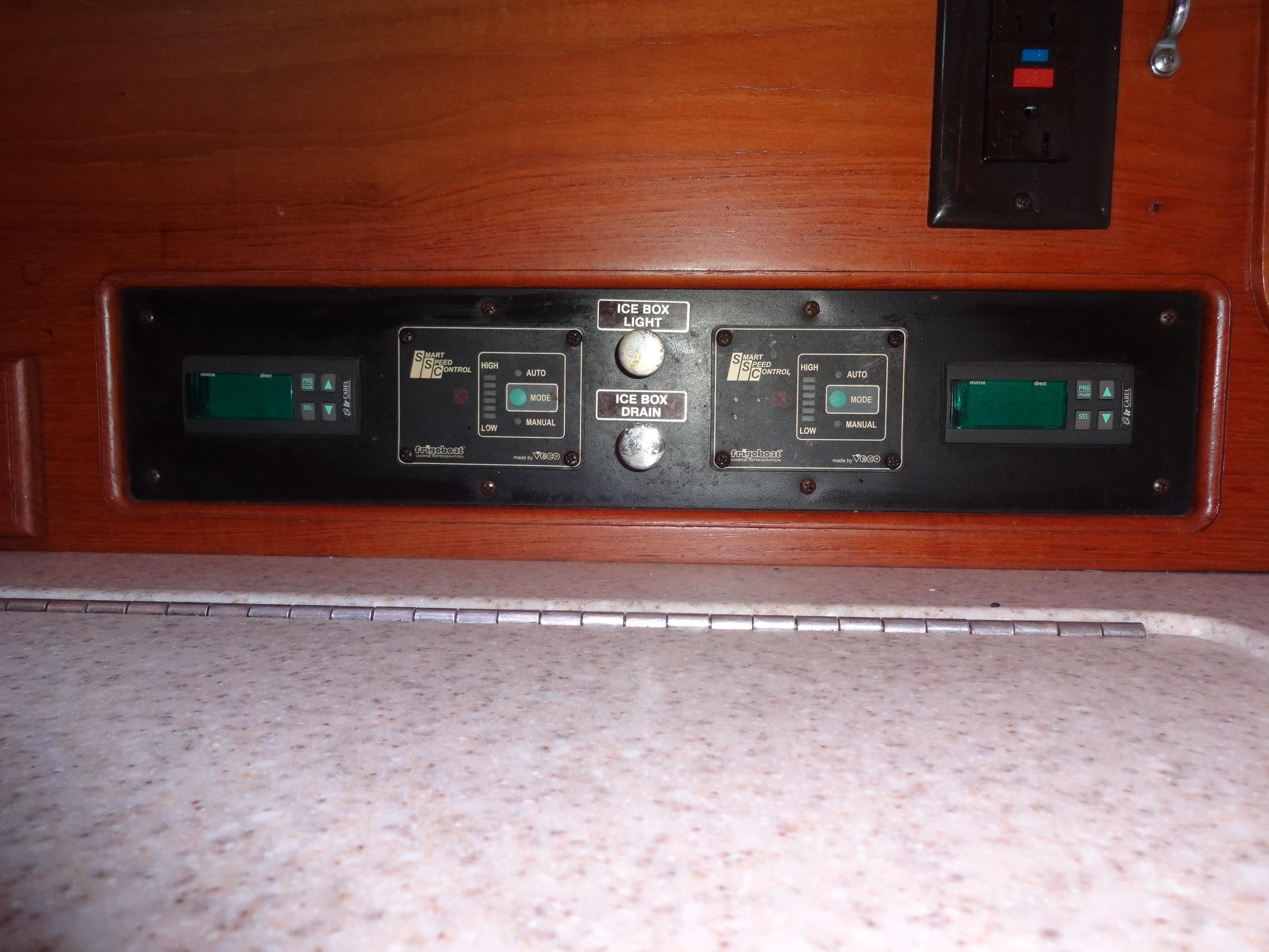 Control panel on 2006 Island Packet 440 yacht, featuring digital displays and switches.