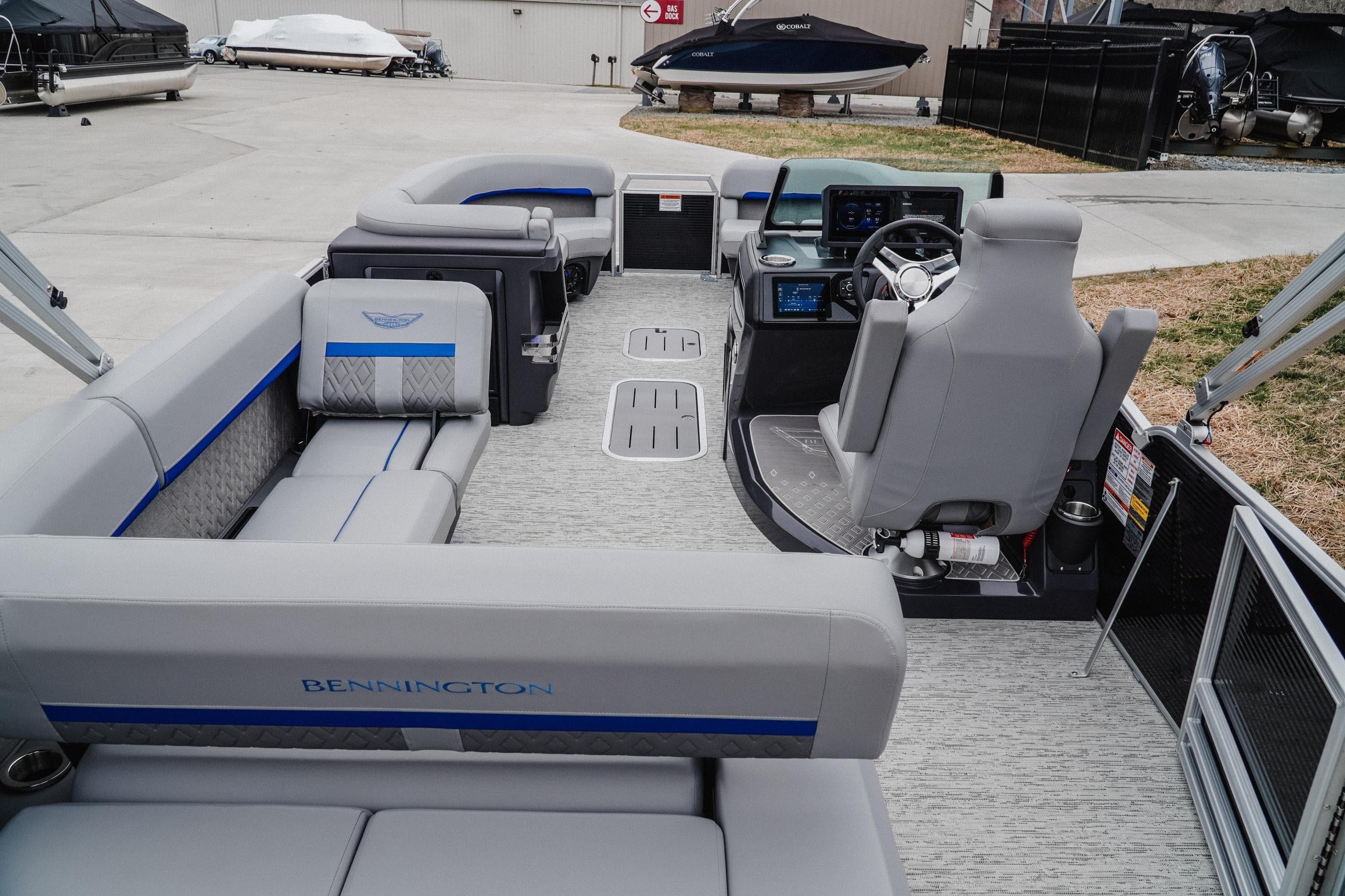 2025 Bennington 24MSB pontoon boat interior with modern seating and helm controls.