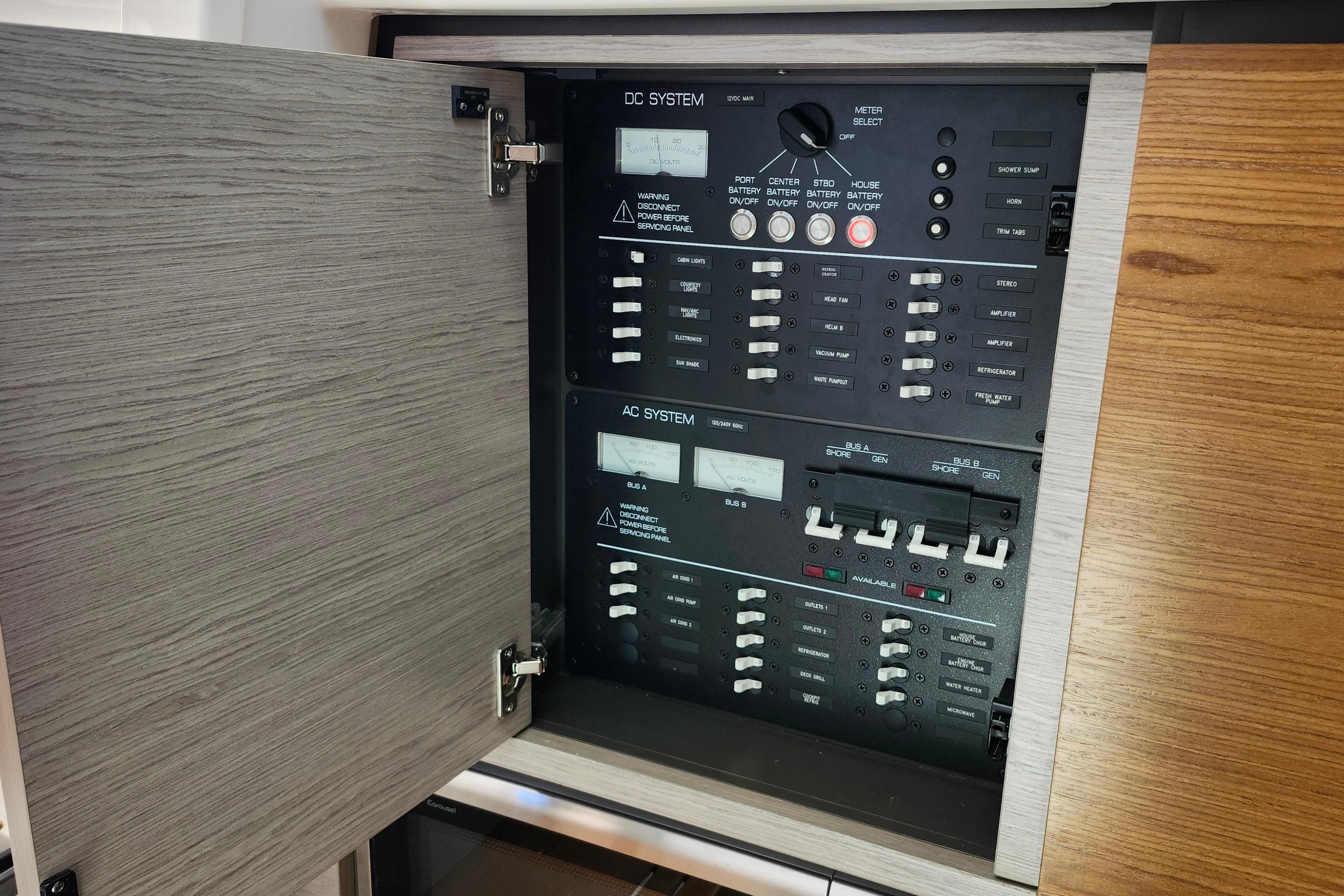 Electrical panel of 2022 Tiara Yachts 38 LS, showcasing DC and AC systems.