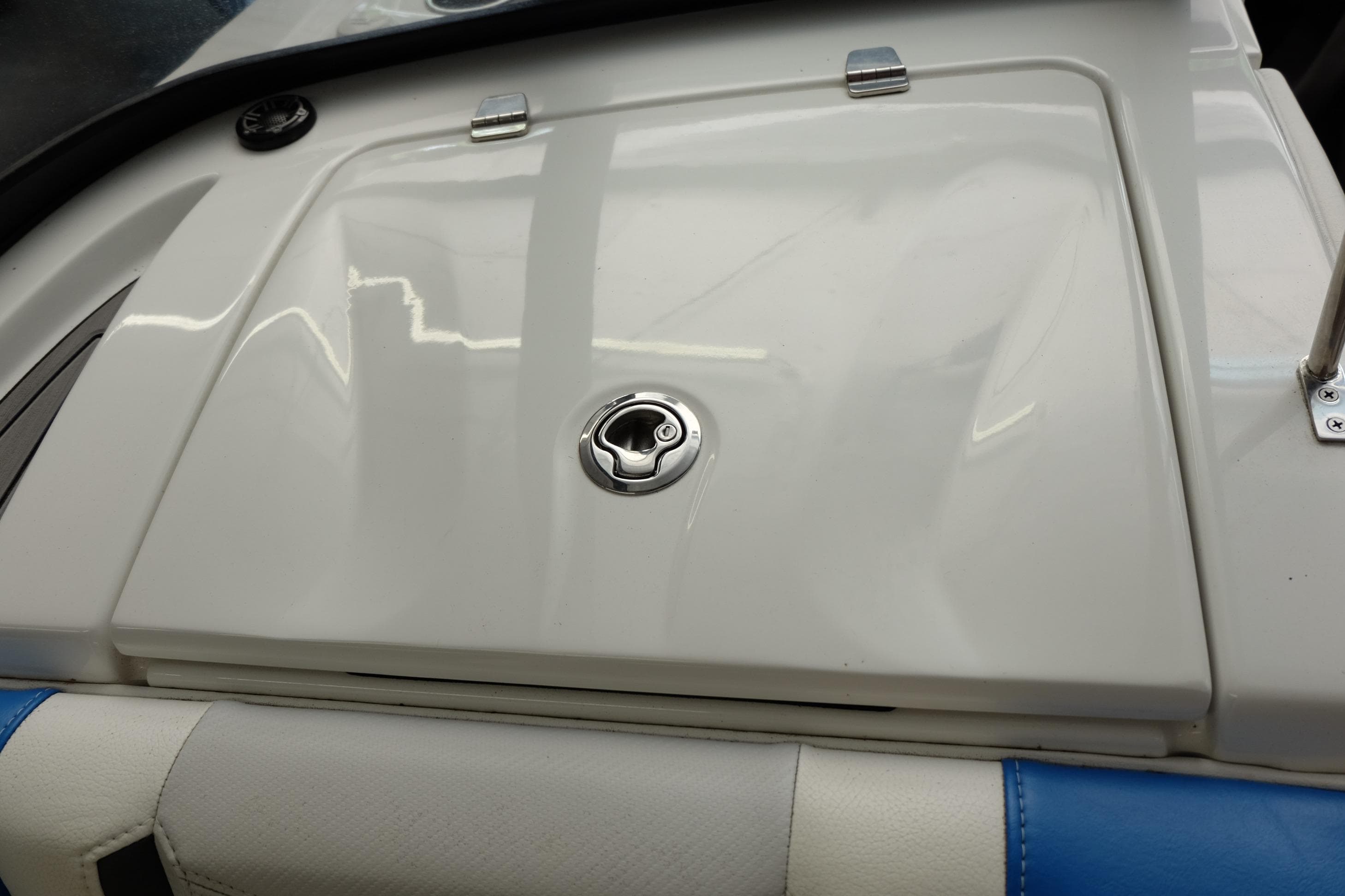 2017 Nautique Super Air Nautique G21 boat hatch with sleek white finish and chrome details.