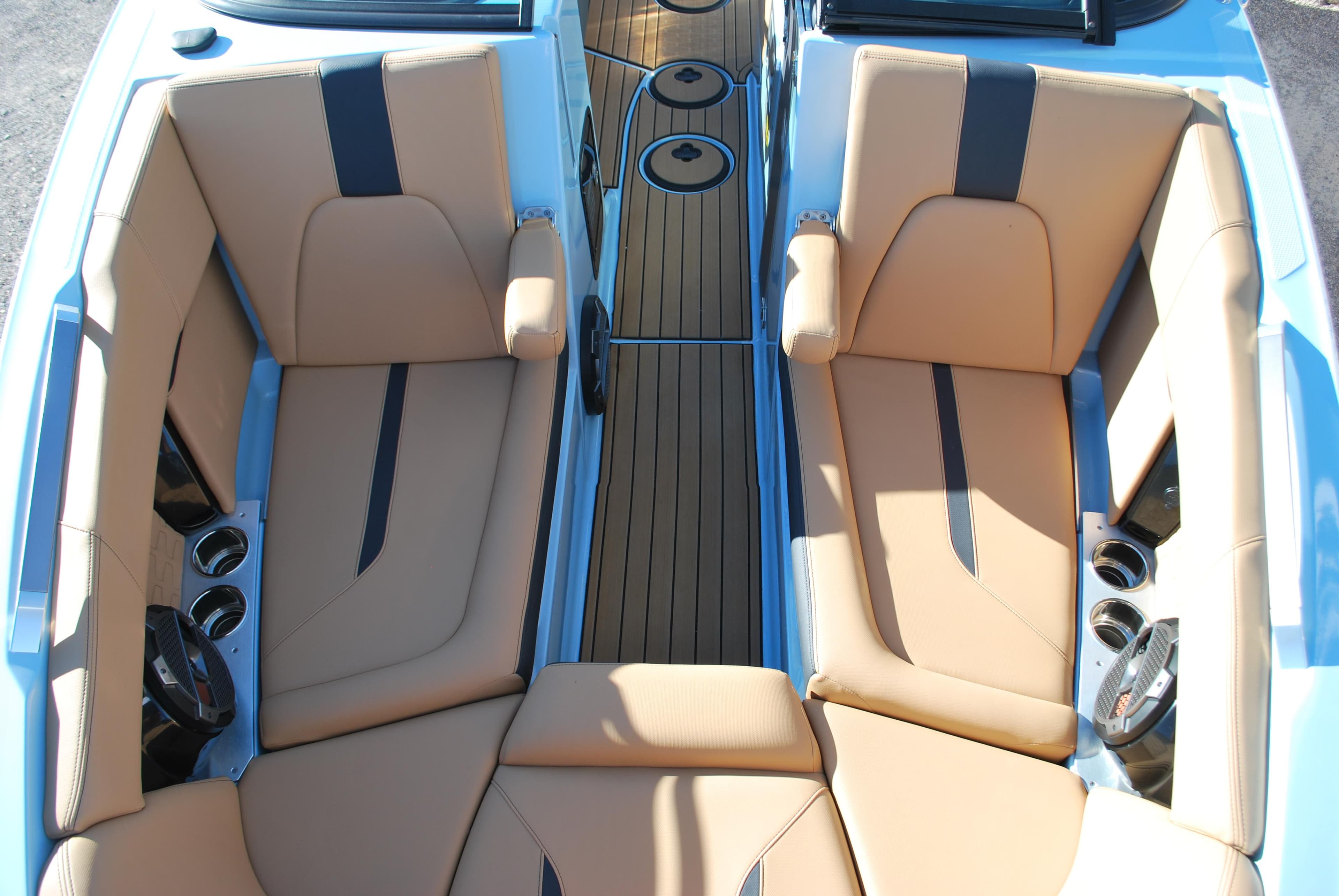 2022 MasterCraft X24 boat interior with tan leather seats and sleek design.