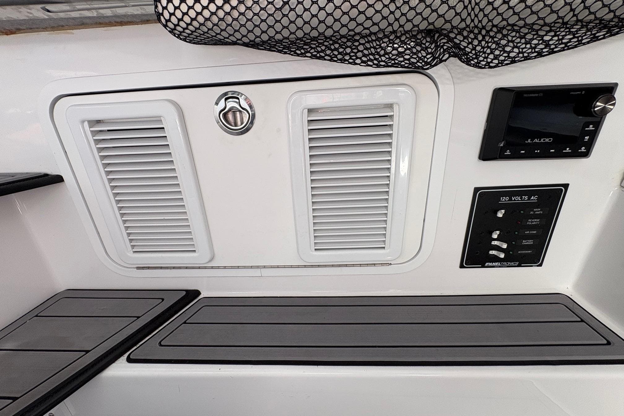 2023 Nor-Tech 390 Sport Center Console dashboard with JL Audio system and control panel.