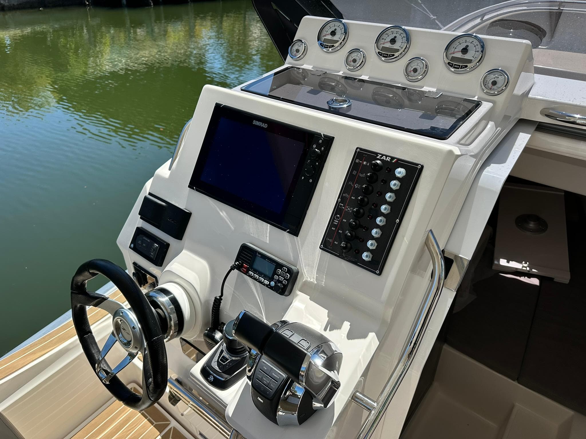Control panel of 2022 Zar Formenti 95 SL boat with modern navigation equipment.