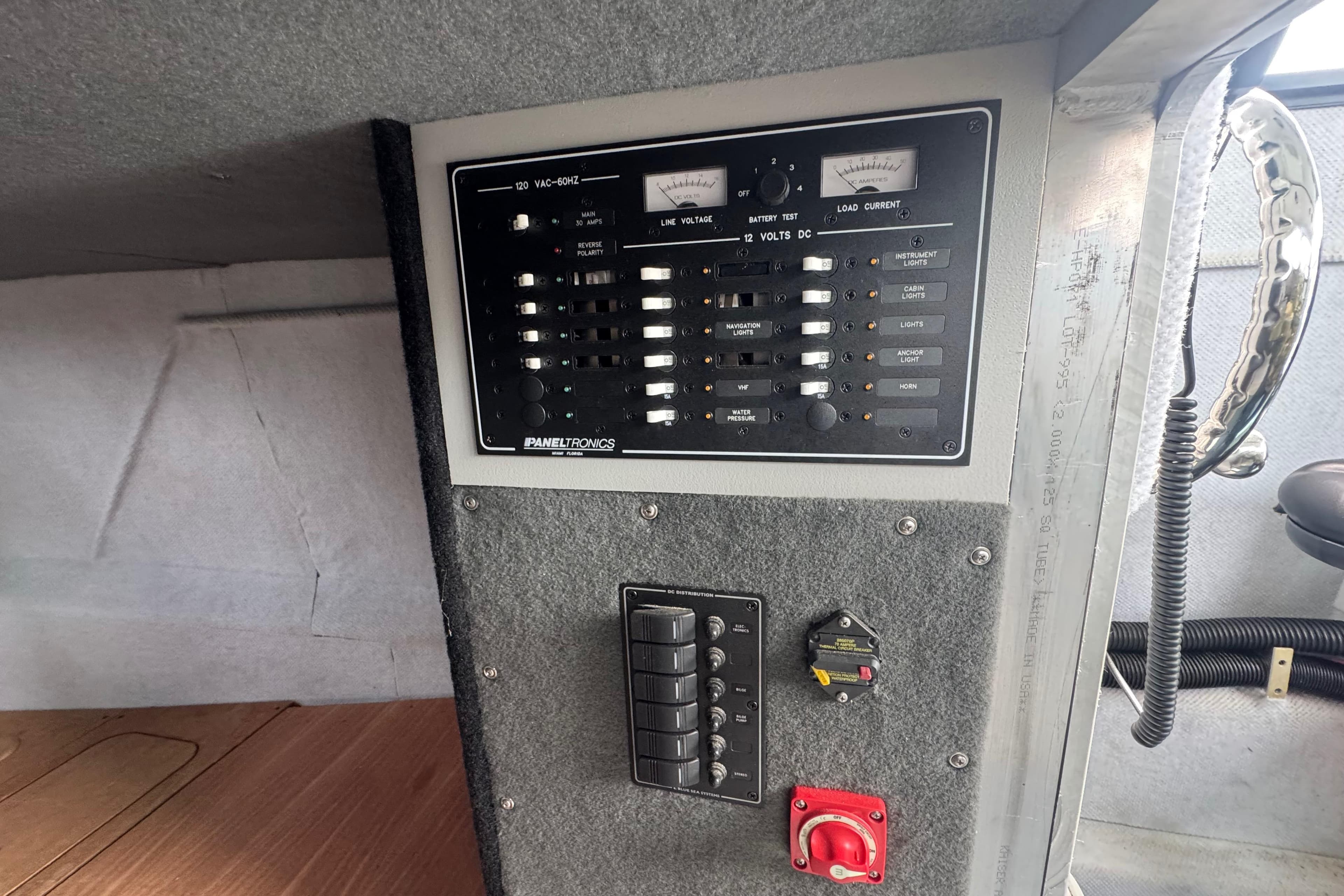Electrical control panel in ACB 30, 2003 model, featuring switches and meters.