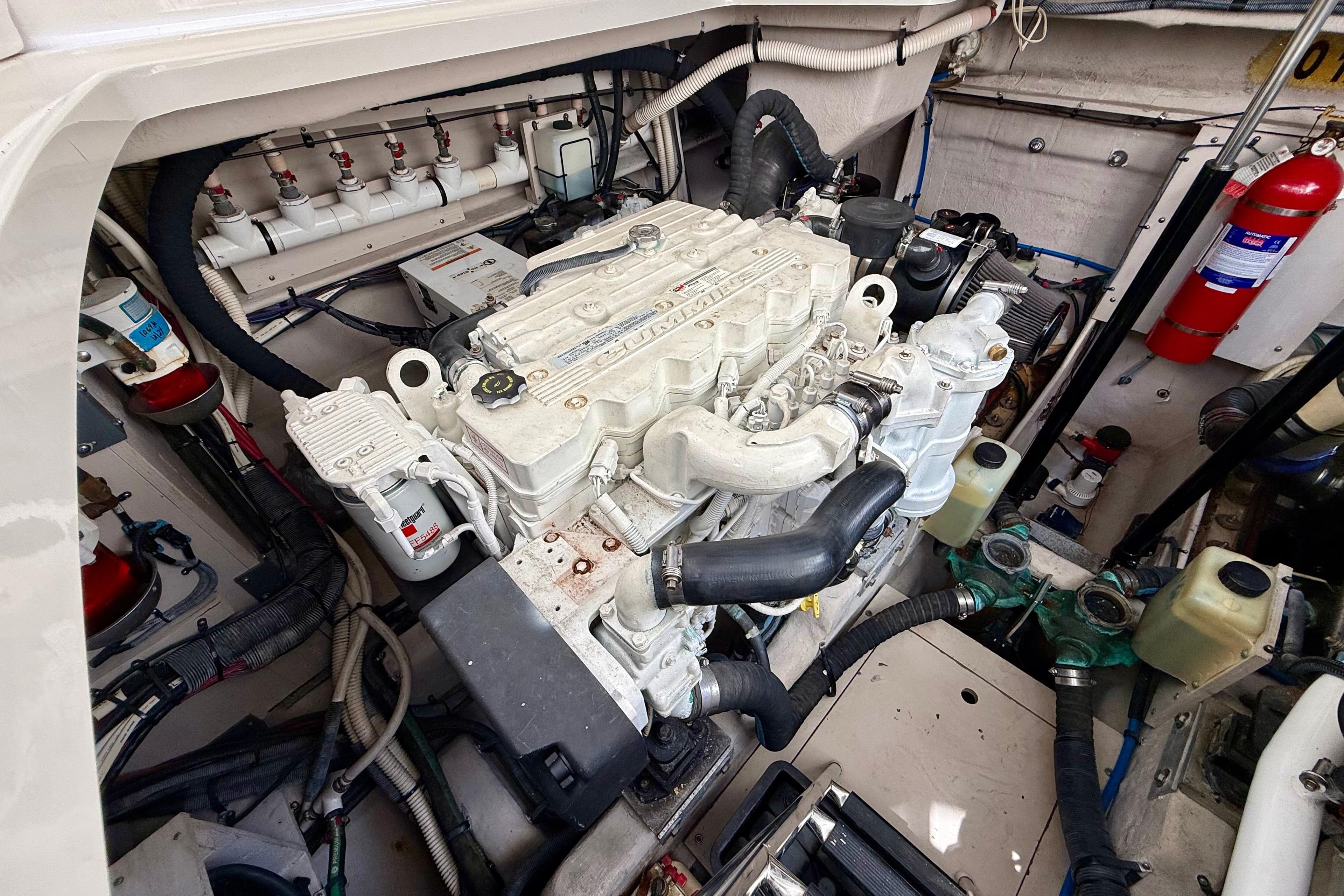 Engine compartment of a 2012 Sea Ray 410 Sundancer boat, showcasing detailed machinery.