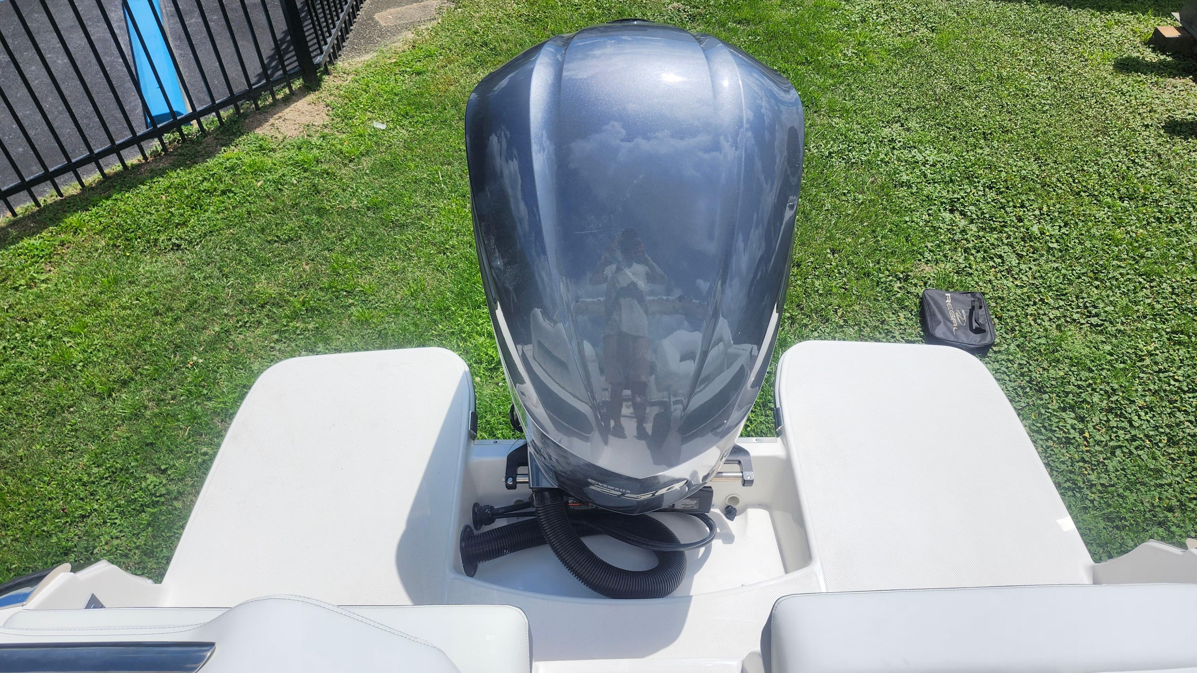 2026 Regal LX4 boat engine on grassy background, viewed from above.