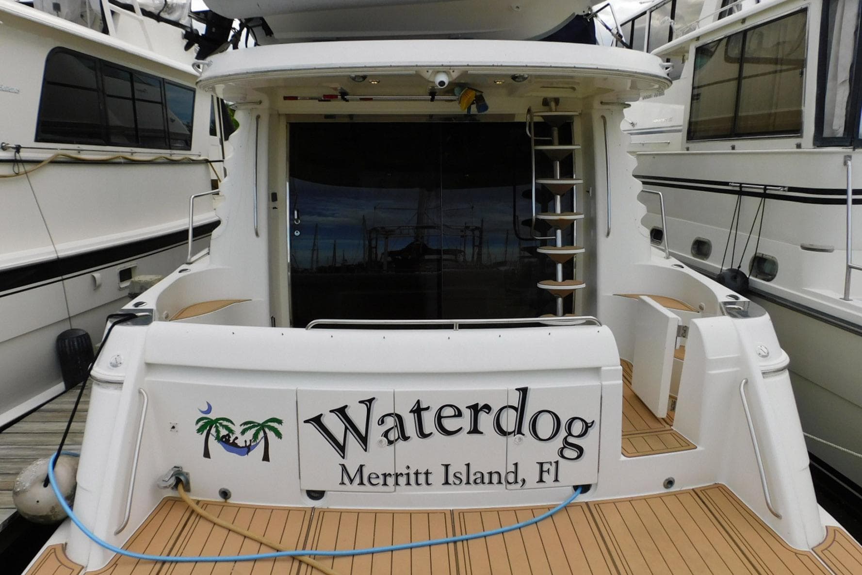 2002 Carver 570 Voyager Pilothouse yacht docked, named "Waterdog," Merritt Island, Florida.