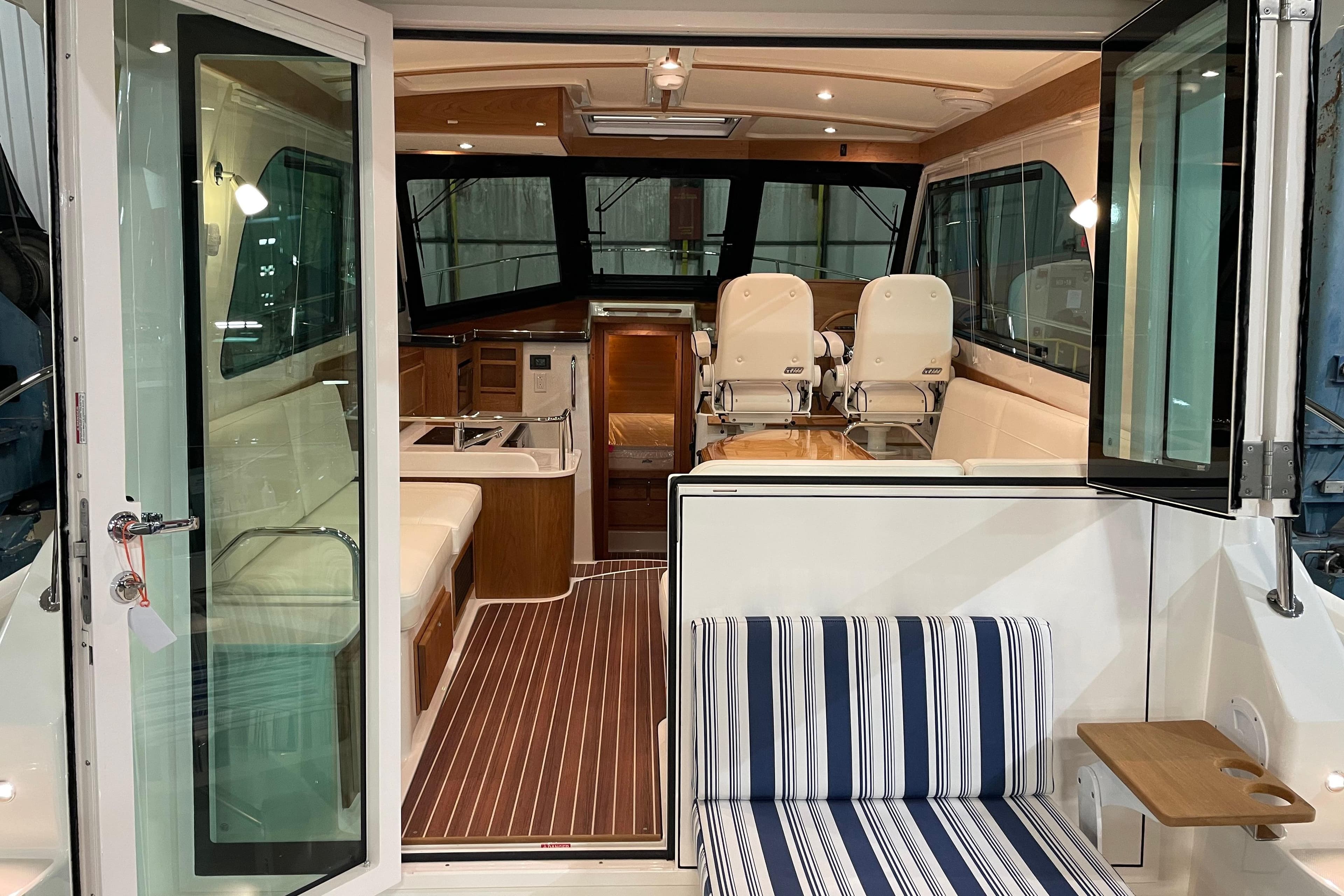 Interior view of 2026 Back Cove 372 yacht, featuring elegant seating and modern design.