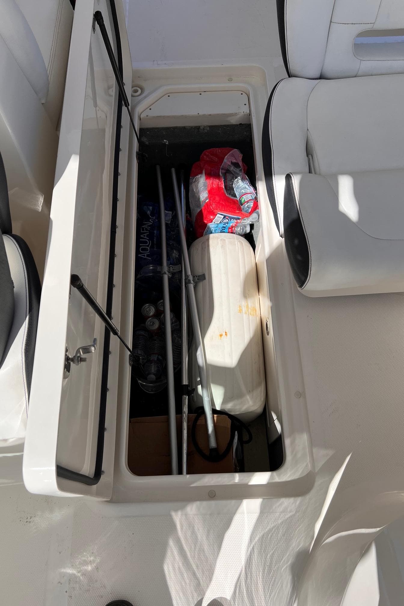 Storage compartment in 2015 Sea Ray SLX 350 boat.