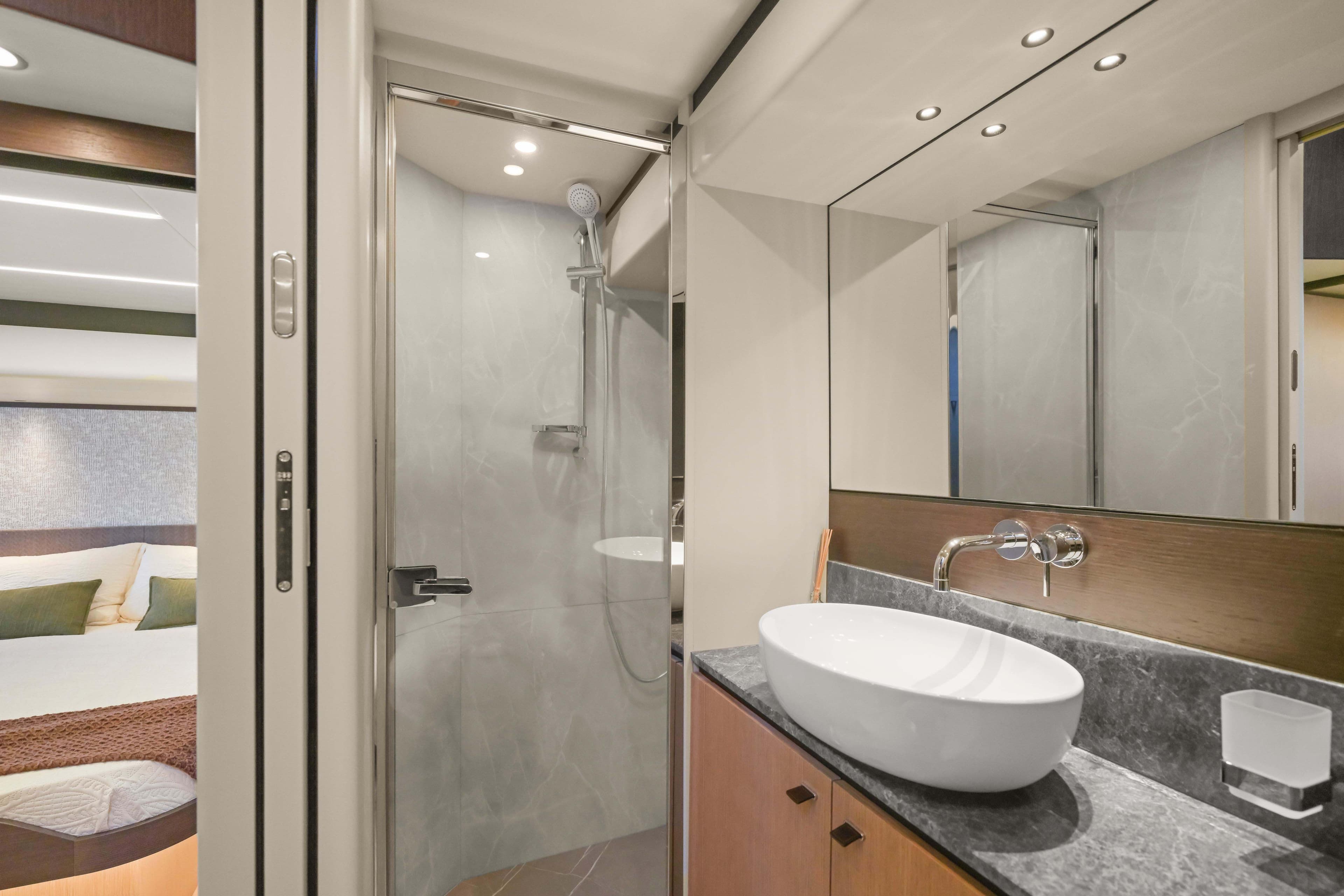 Luxurious bathroom interior of 2026 Absolute 52 Fly yacht with modern fixtures and elegant design.
