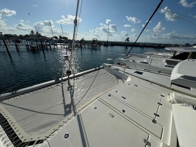 Leopard 50 catamaran deck with marina view, sunny day, 2020 model.