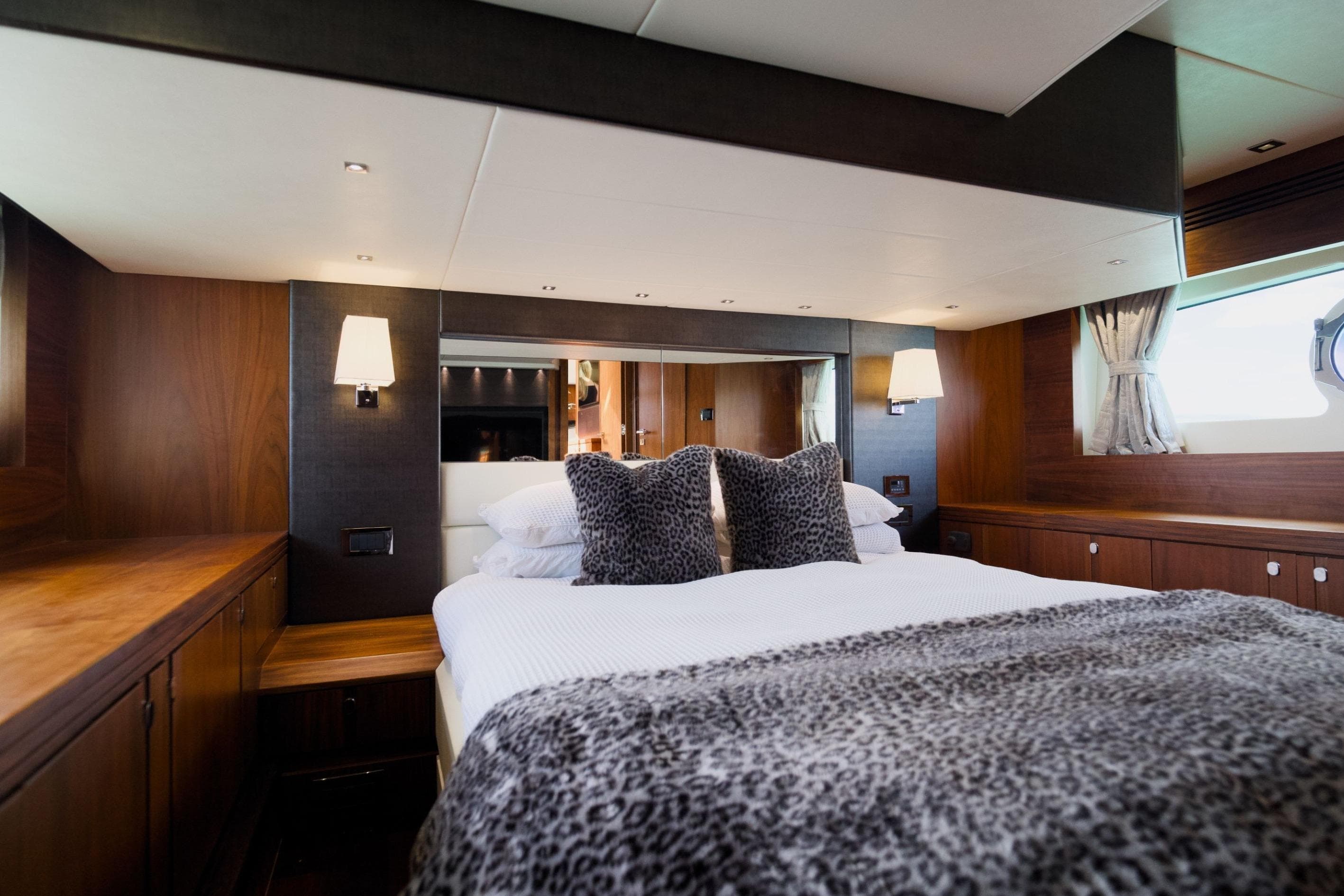 Luxurious bedroom interior of 2013 Sunseeker San Remo 485 yacht with elegant decor.
