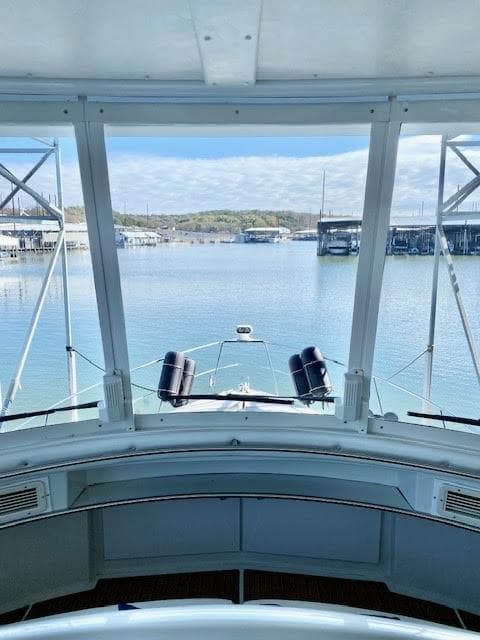 1999 Carver 456 Aft Cabin Motor Yacht view from helm, overlooking marina.
