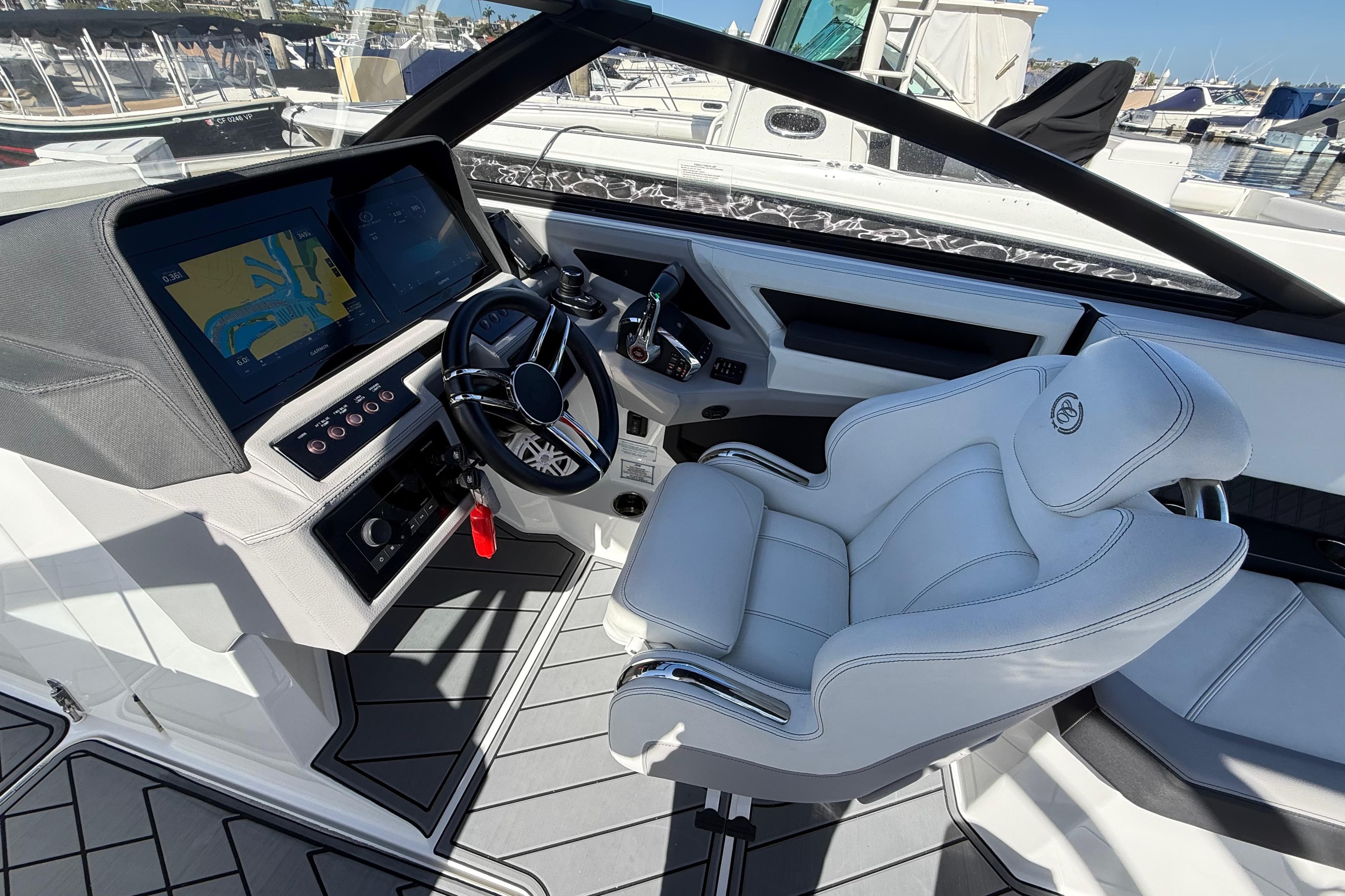 2024 Cobalt R8 Outboard cockpit with modern steering and navigation system.