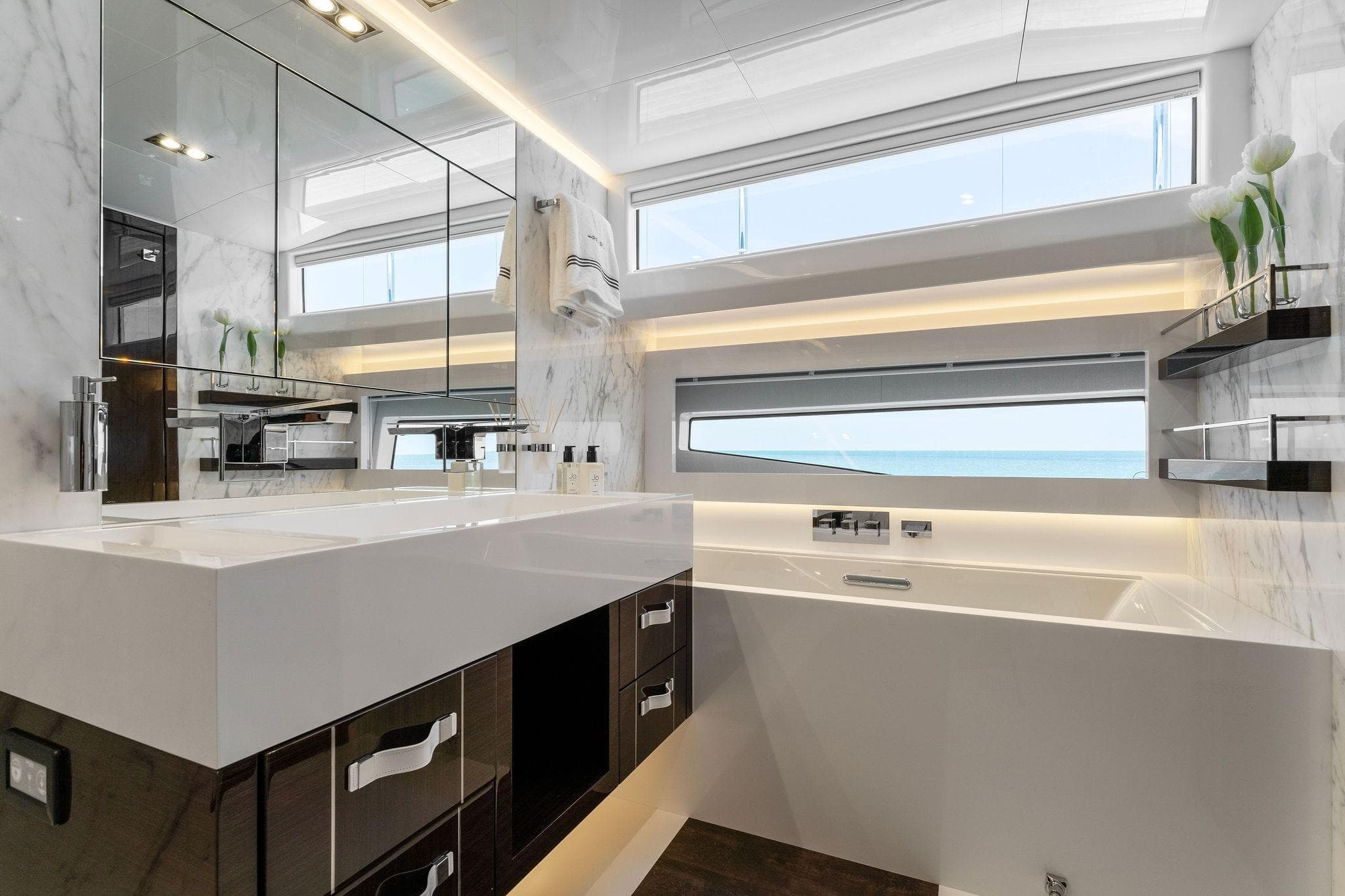 Luxurious modern bathroom on Pearl 95 yacht, featuring sleek marble design and ocean view.