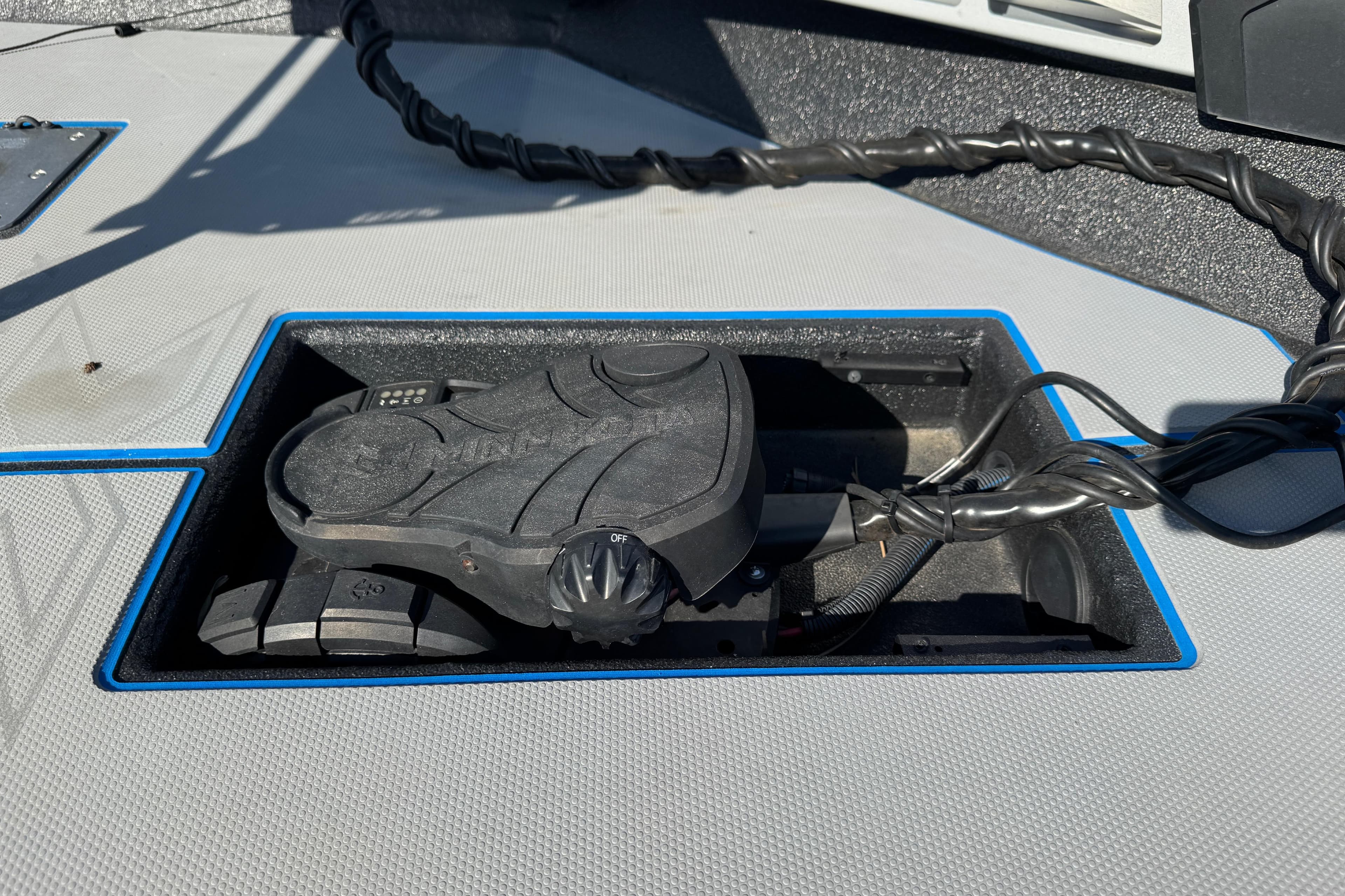 Foot pedal control on Express H20 boat, 2025 model, with wiring and textured surface.