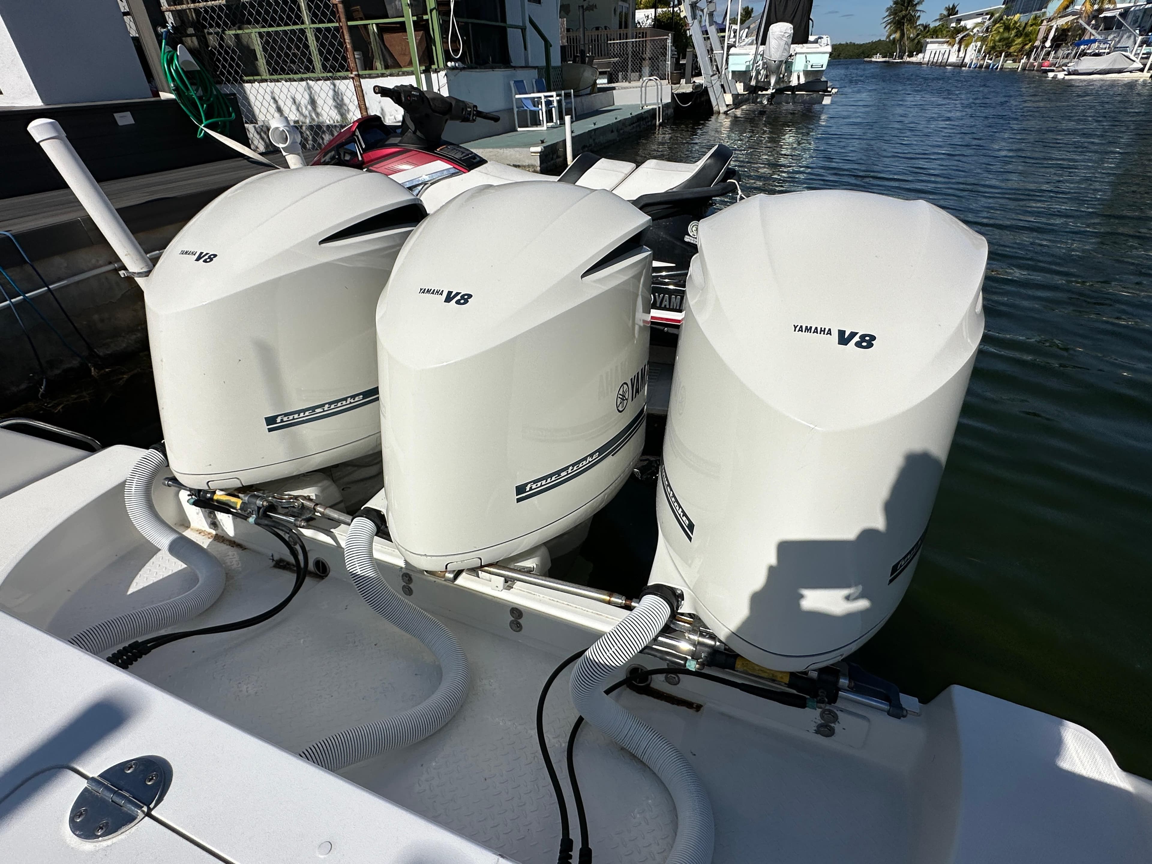 Triple Yamaha V8 outboard engines on a 2008 Everglades 350 CC boat.