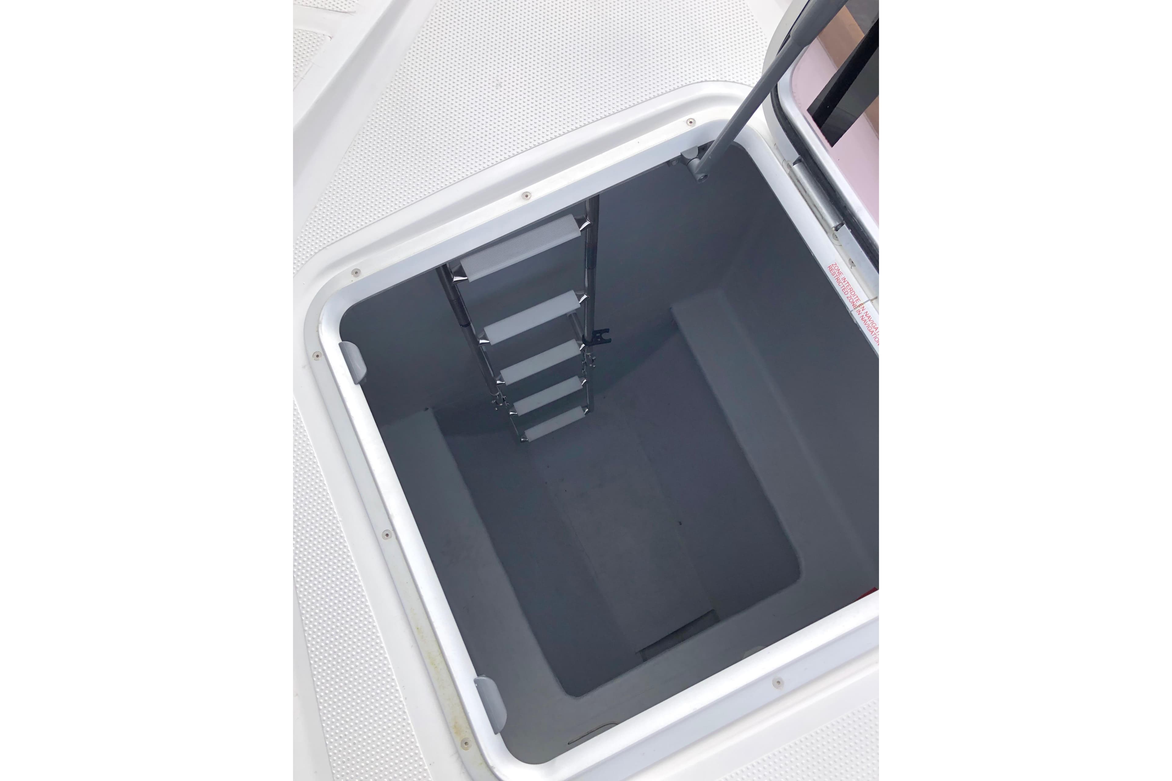 Hatch with ladder on 2022 NEEL 43 trimaran, showcasing interior access.