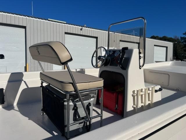 2025 Carolina Skiff E24DLX CC boat interior with console and seating.