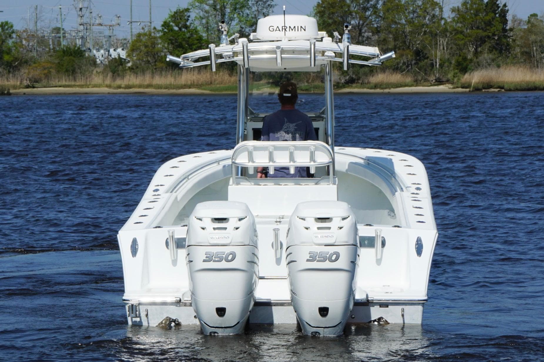 2011 Onslow Bay 27 Offshore boat with twin 350 engines on a calm waterway.