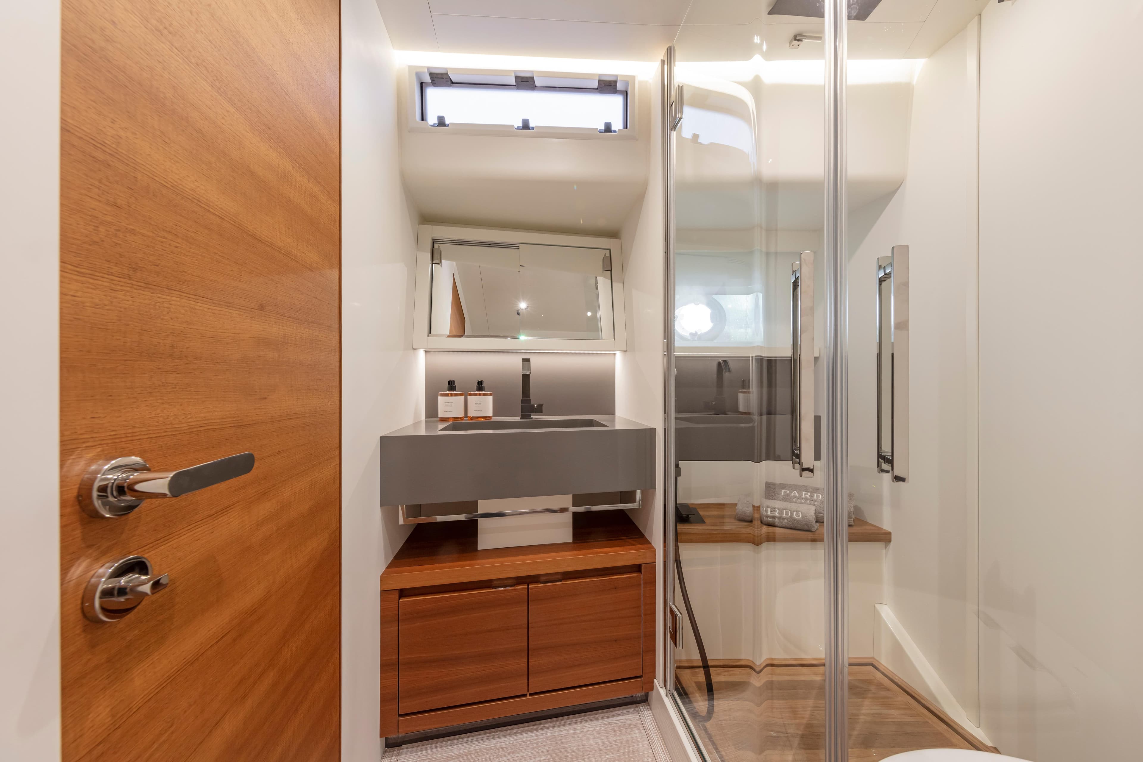 Modern bathroom interior on 2026 Pardo Yachts E60, featuring sleek design and wooden accents.