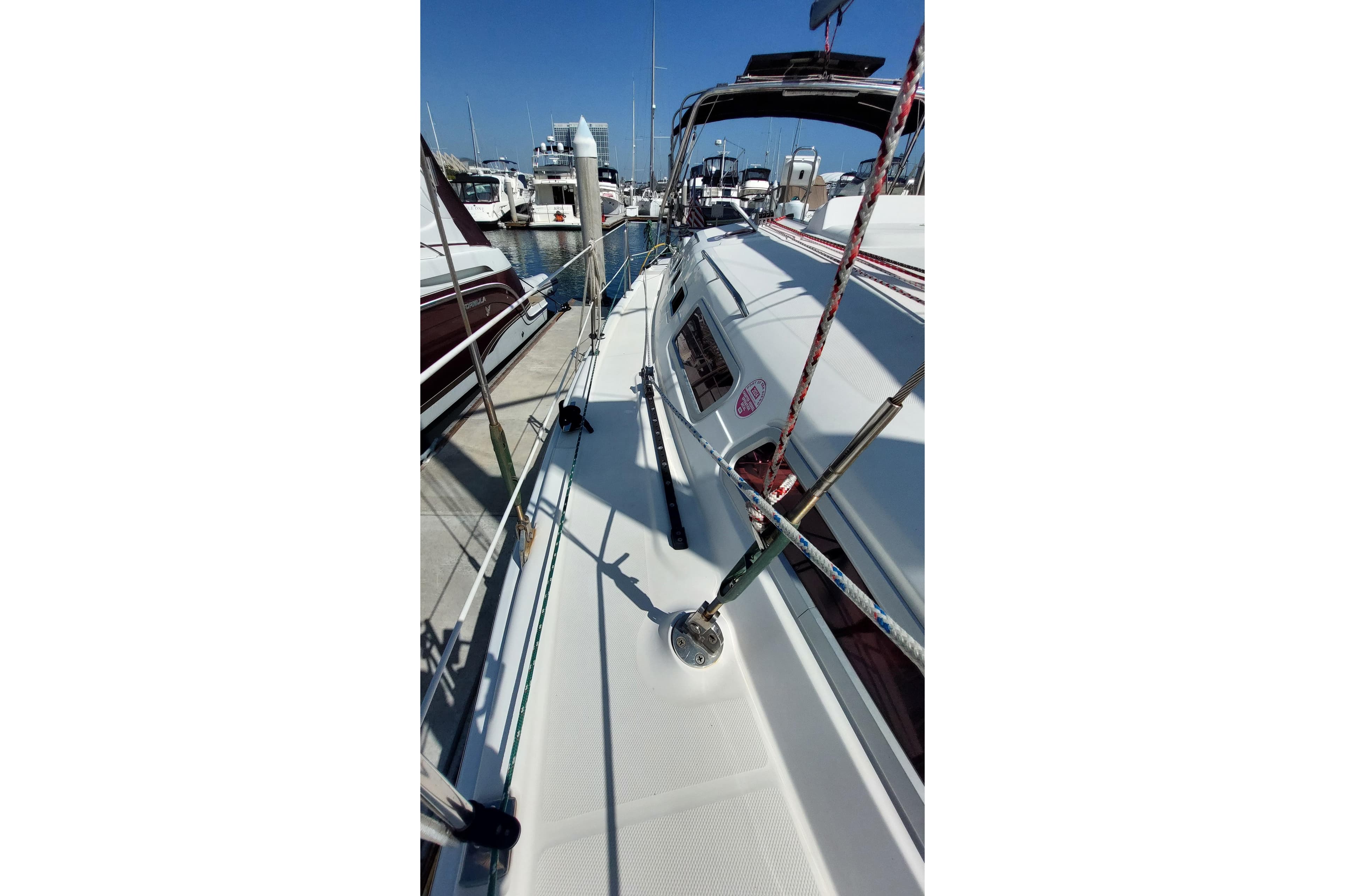 2005 Hunter 38 sailboat docked at marina, showcasing deck and rigging.