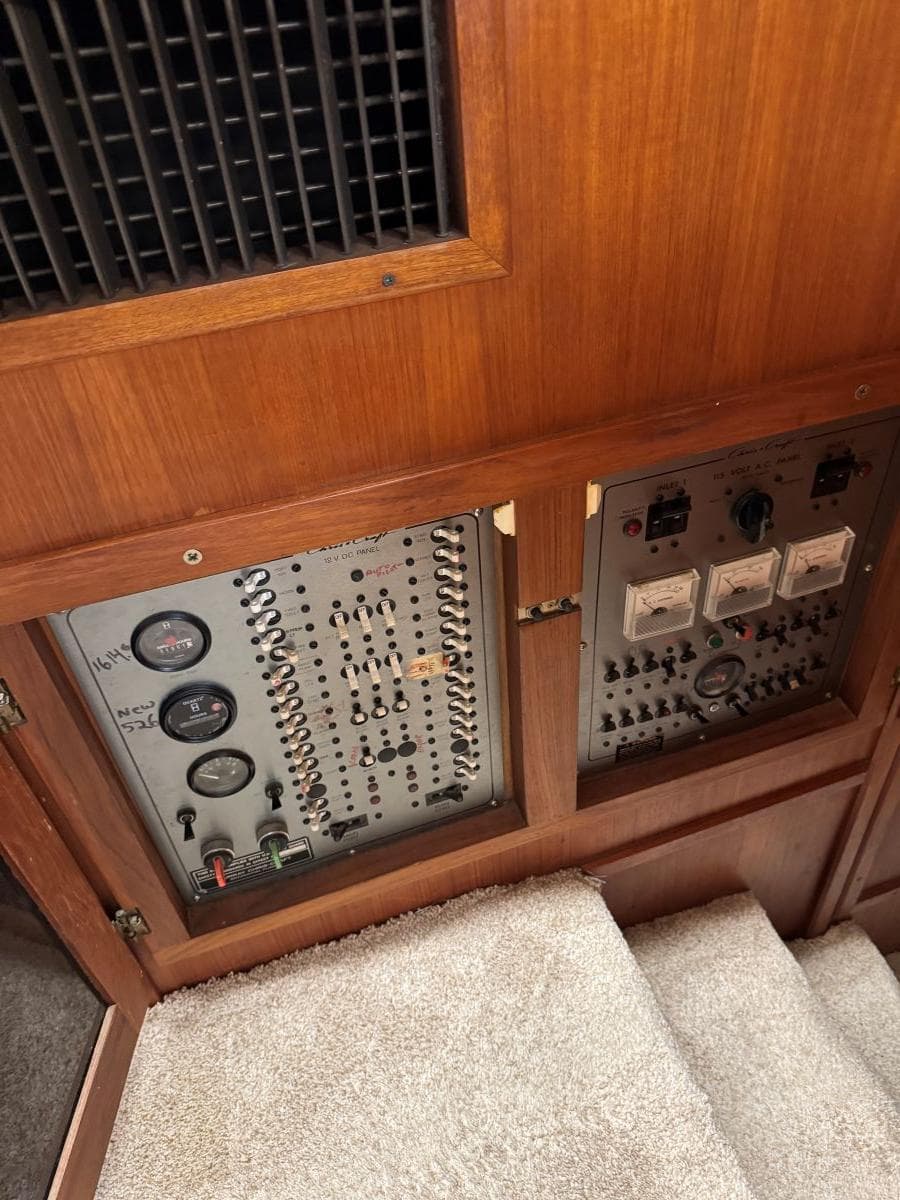 Electrical panel of 1988 Chris-Craft 426 Catalina yacht, featuring gauges and switches.