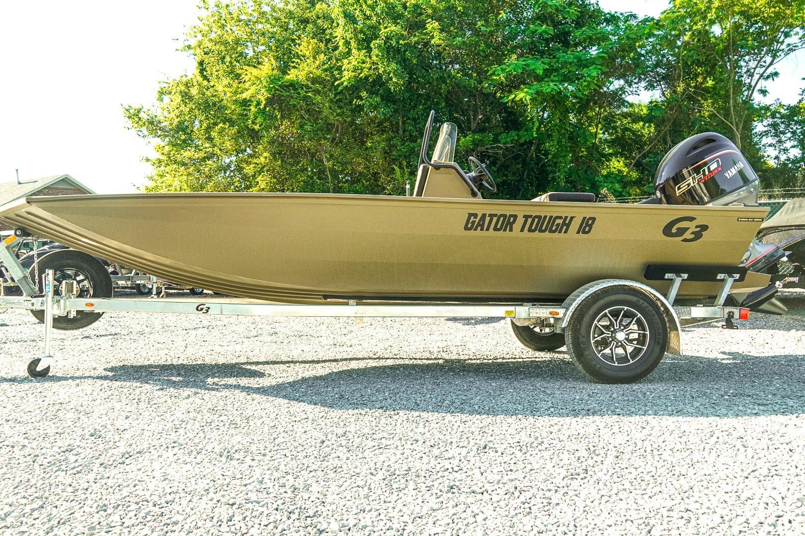 2026 G3 Gator Tough 18 CC boat on trailer, parked outdoors.
