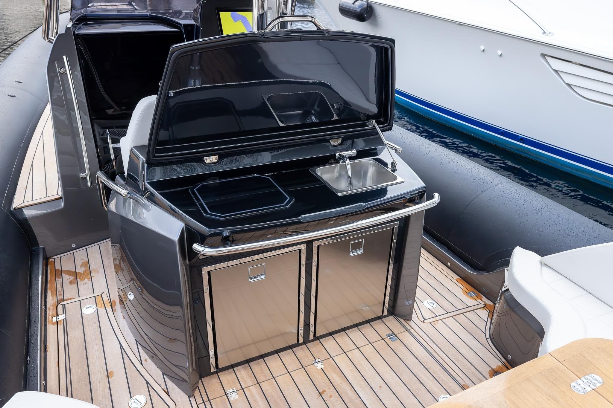 2024 SACS Strider 11 featuring modern onboard kitchen and sink.