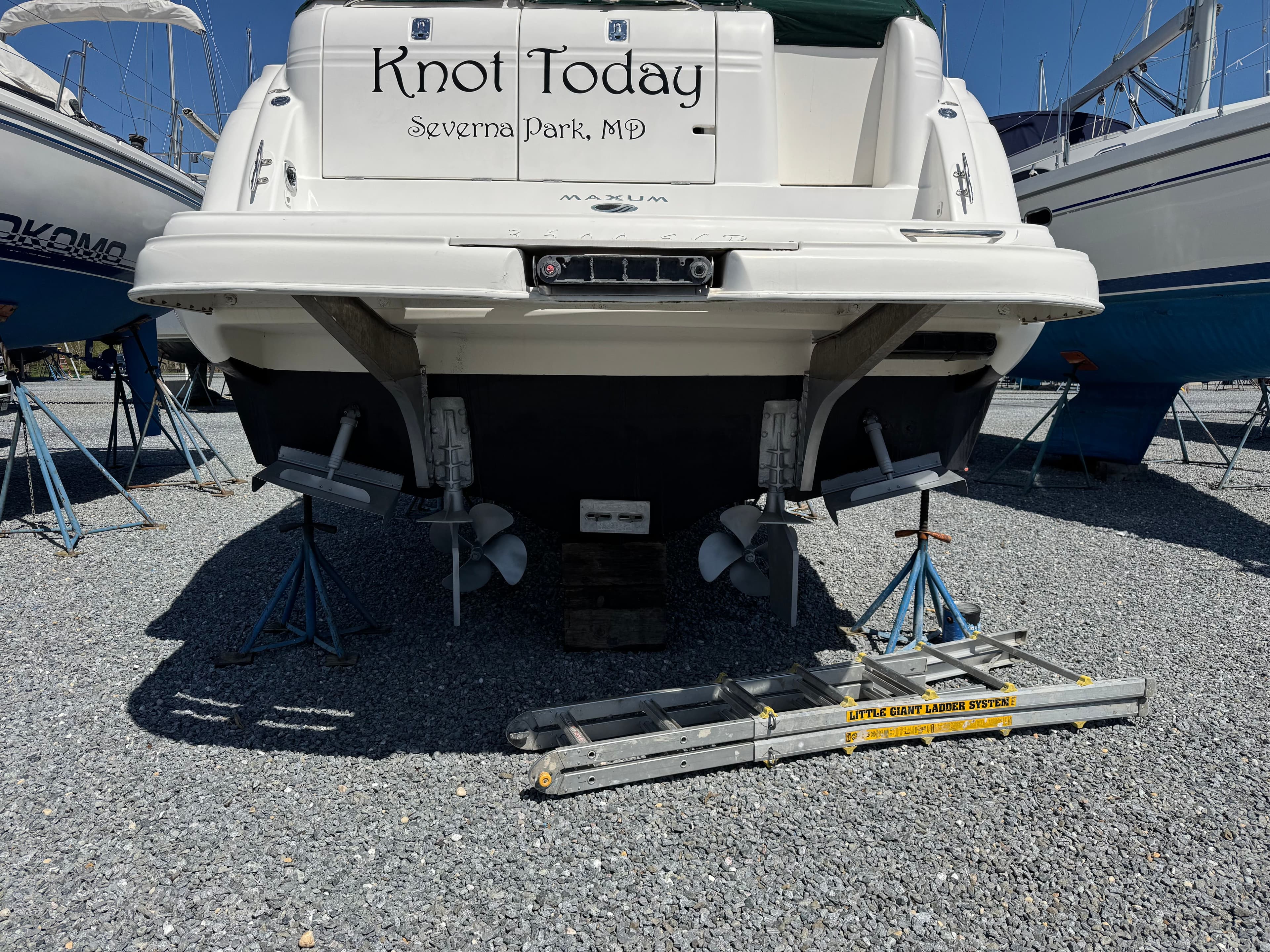 Rear view of a 2001 Maxum 3500 SCR boat in dry dock.