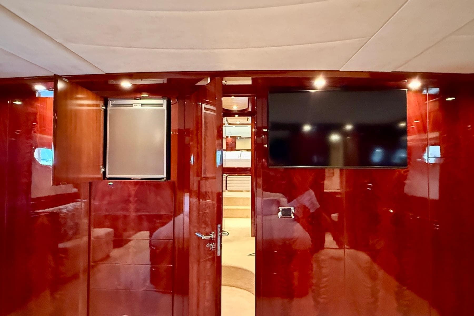 Luxurious interior of 2003 Astondoa 82' GLX yacht with wood paneling and modern amenities.