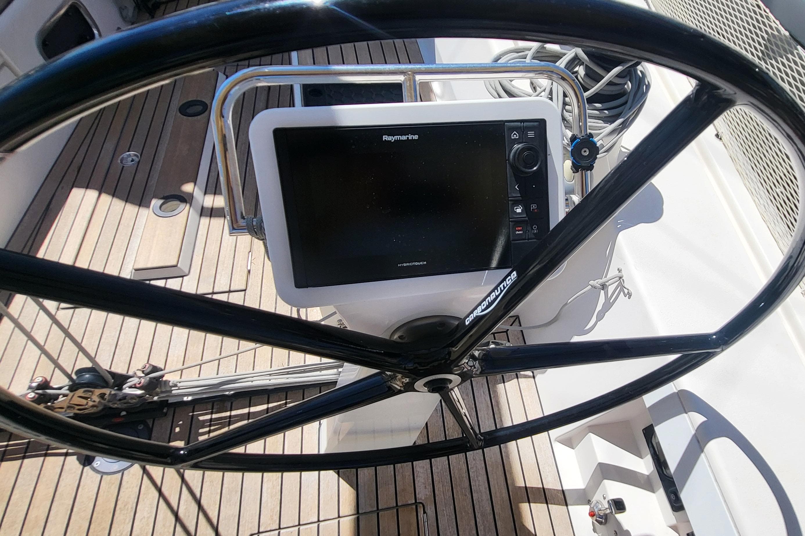 Steering wheel and navigation system on 2016 X-Yachts Xp 38 sailboat.