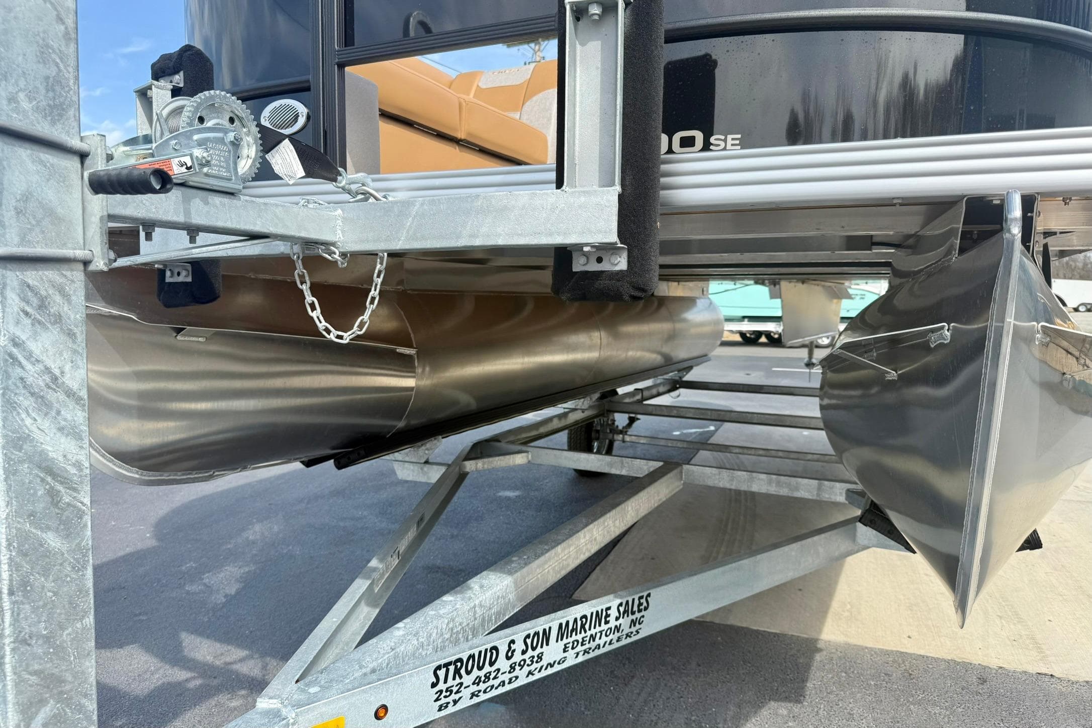 2026 Crest Conquest SE 200 Fish pontoon boat on trailer, showcasing undercarriage and pontoons.