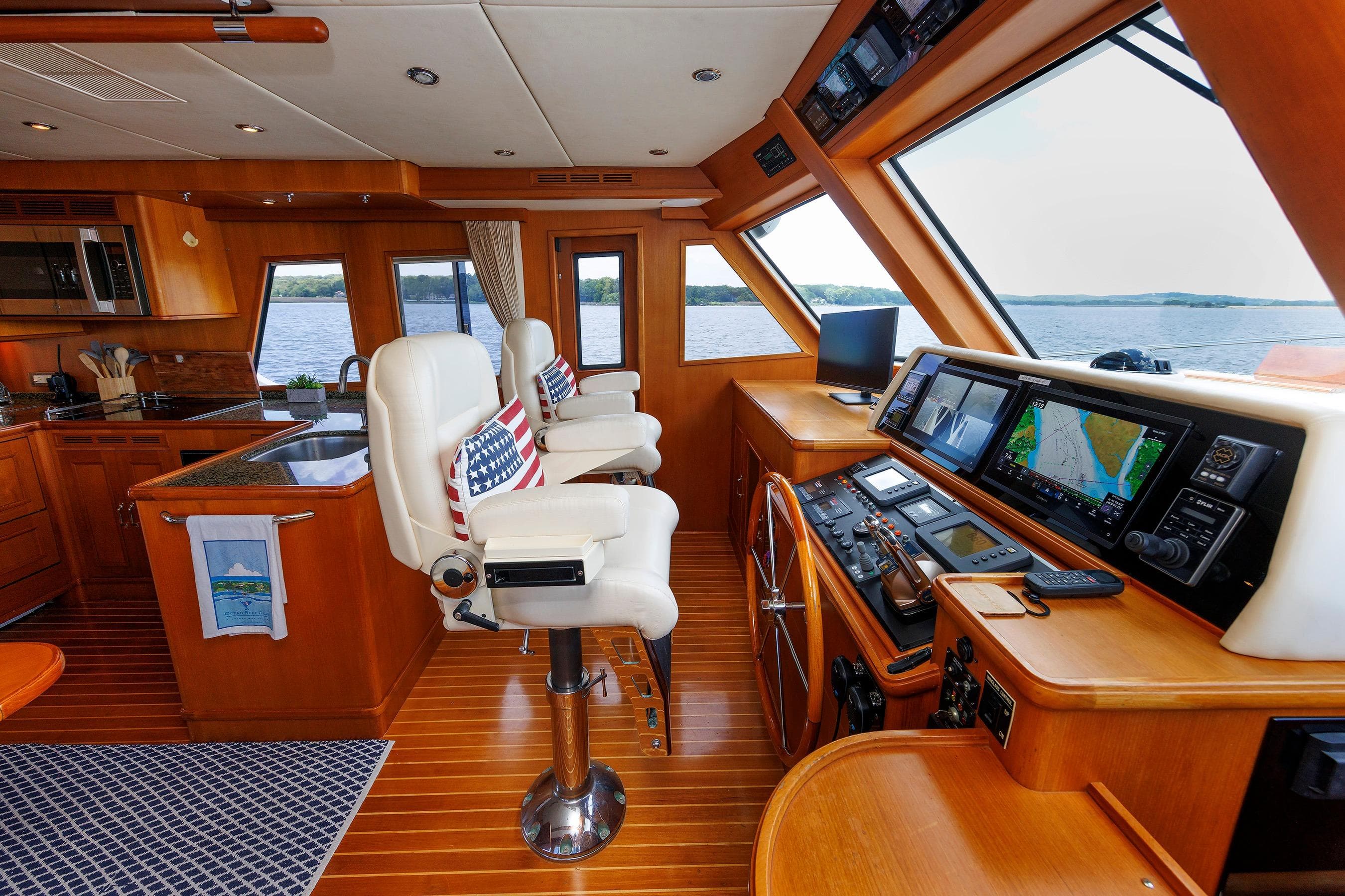 Luxurious 2007 Grand Banks 59 Aleutian RP yacht interior with helm, navigation equipment, and seating.
