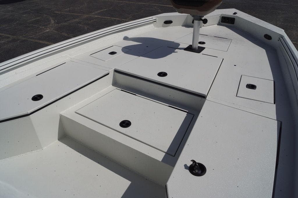 2026 Excel 230 Bay Pro Elite boat deck with storage compartments.