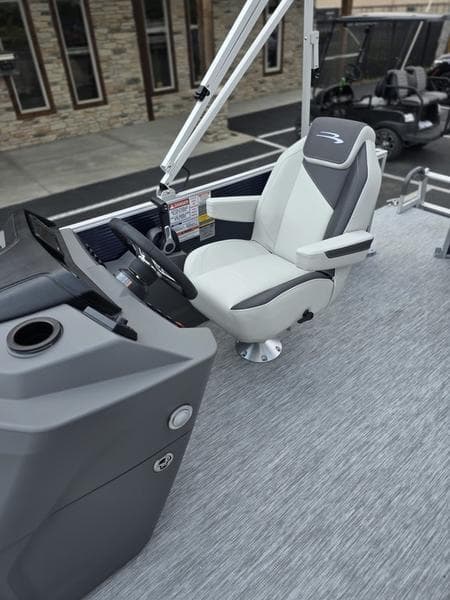 2025 Bennington 20 SL boat interior with modern captain's chair and sleek dashboard design.