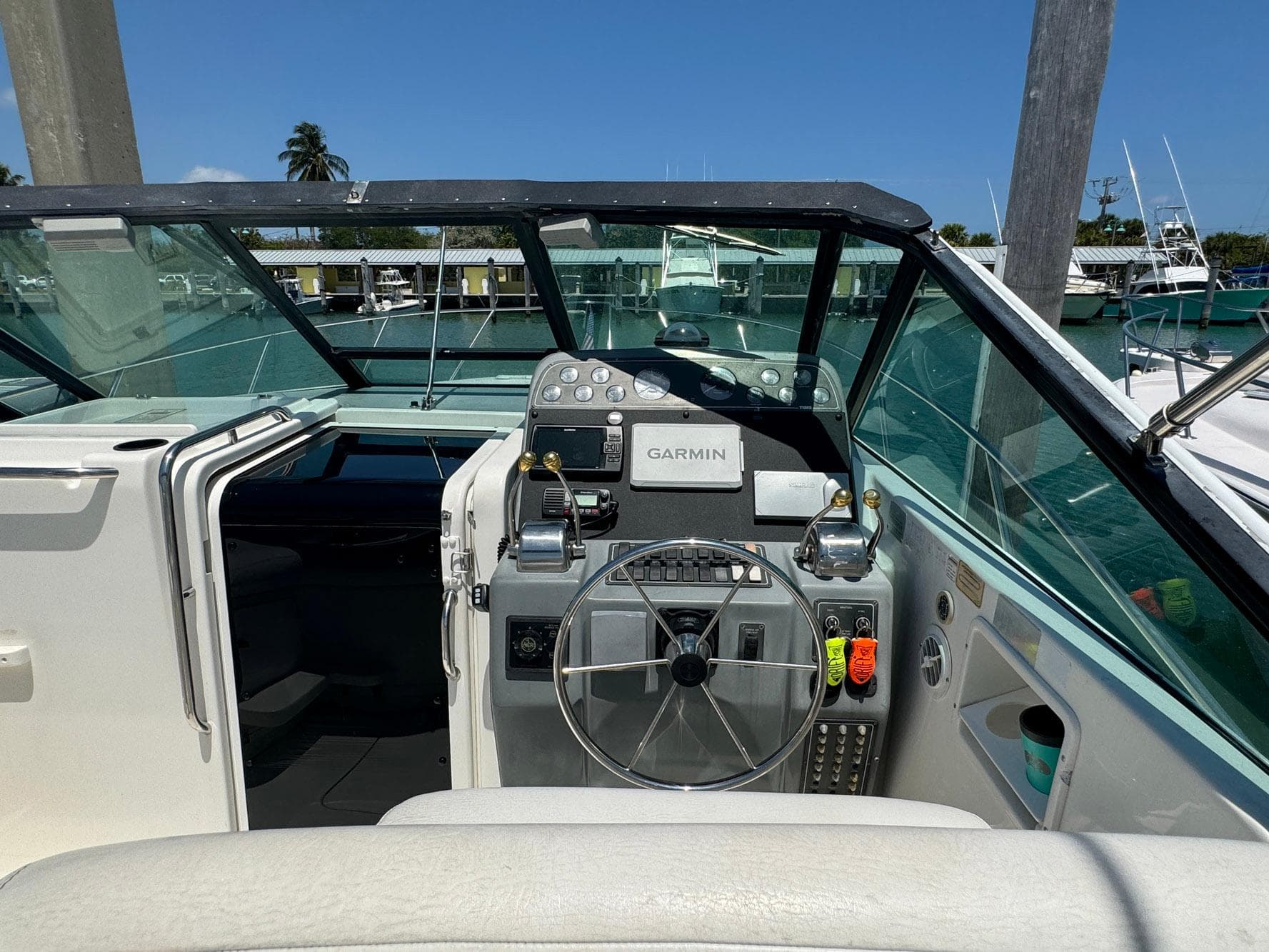 Cockpit of 2000 Tiara Yachts 3100 Open with Garmin navigation system.