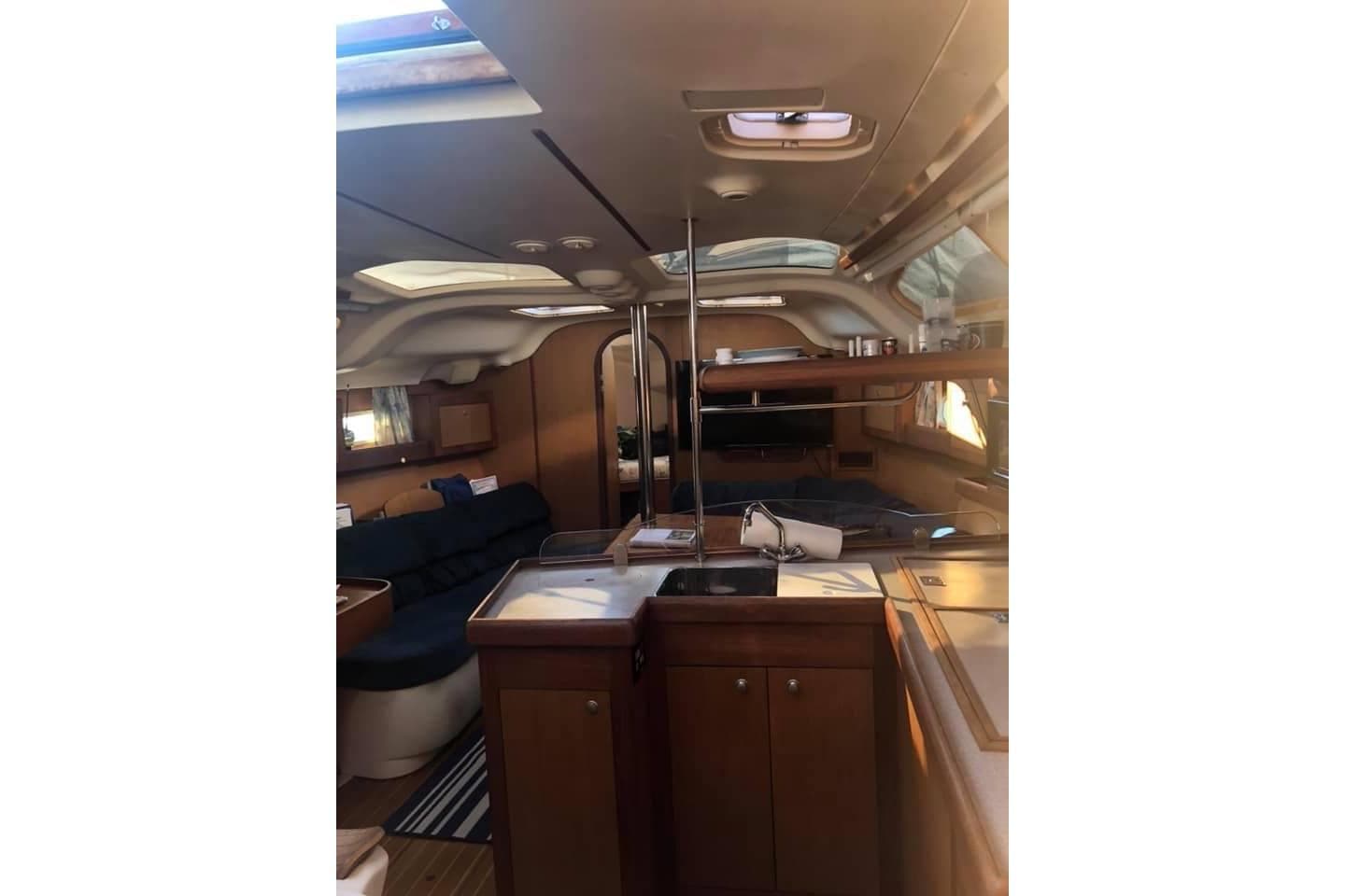 Interior of a 1999 Hunter 380 sailboat, featuring a cozy cabin layout.