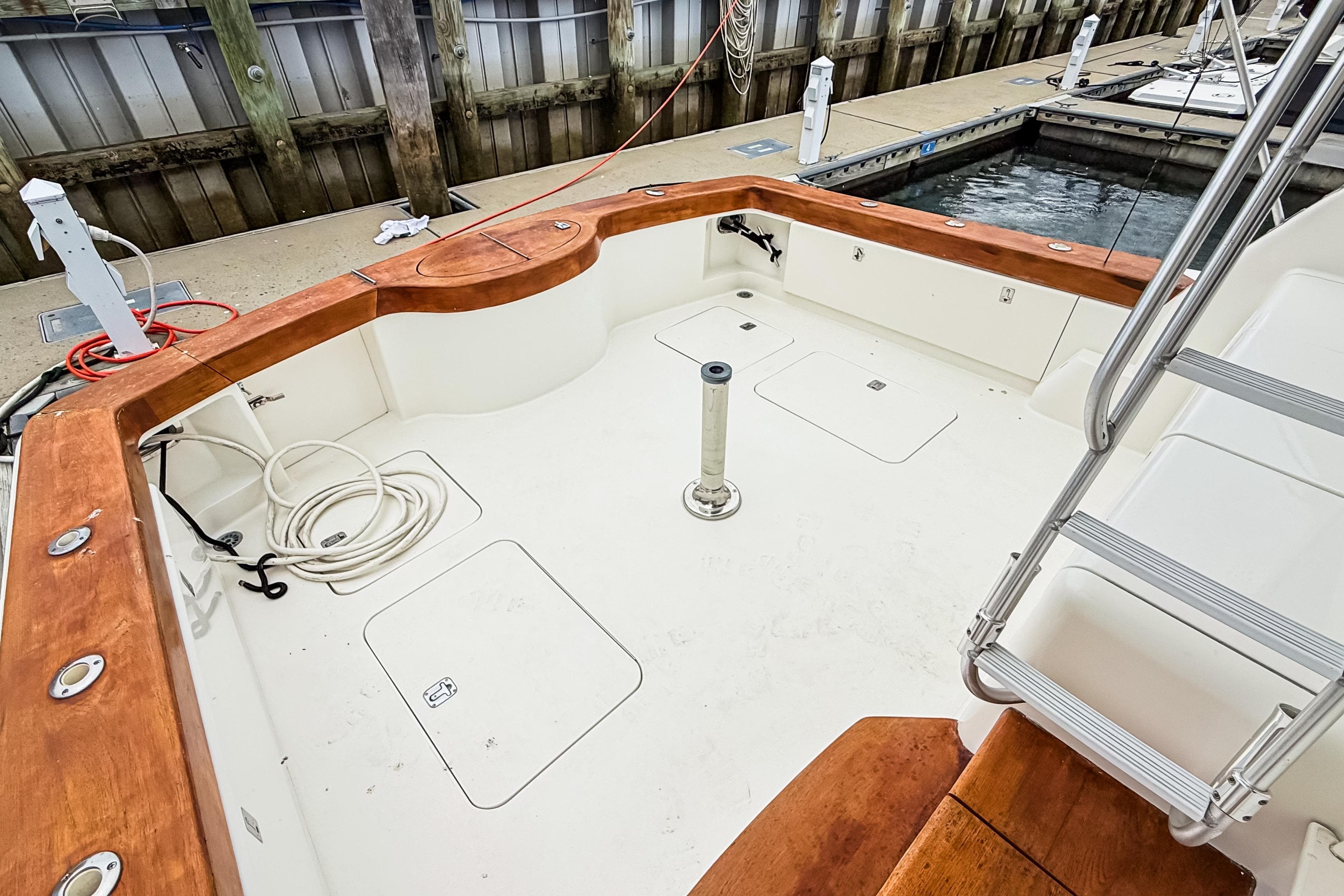 2004 Ocean Yachts 50 Super Sport cockpit with wooden trim and dockside view.