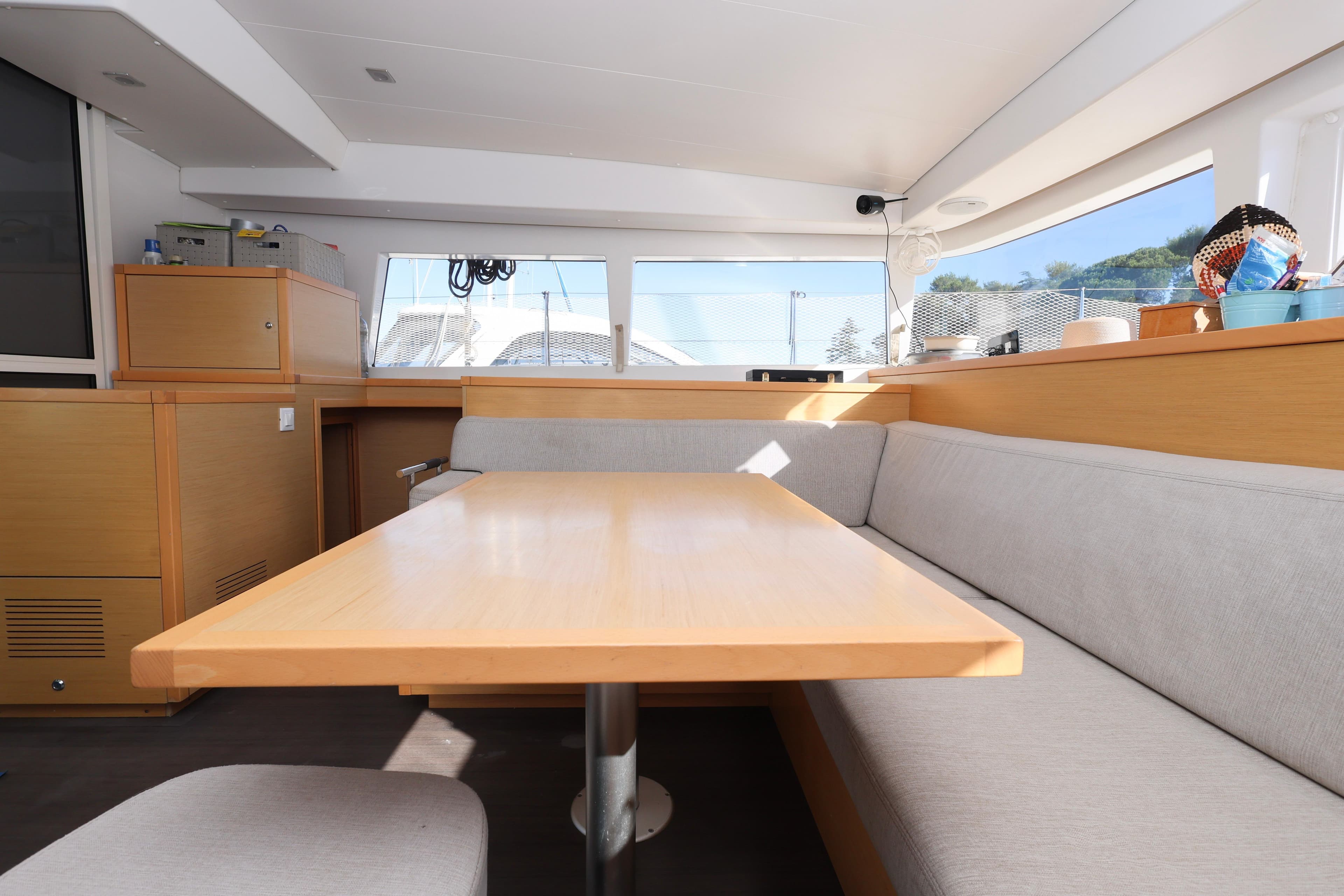 Interior of 2014 Lagoon 400 S2 catamaran with modern seating and dining area.