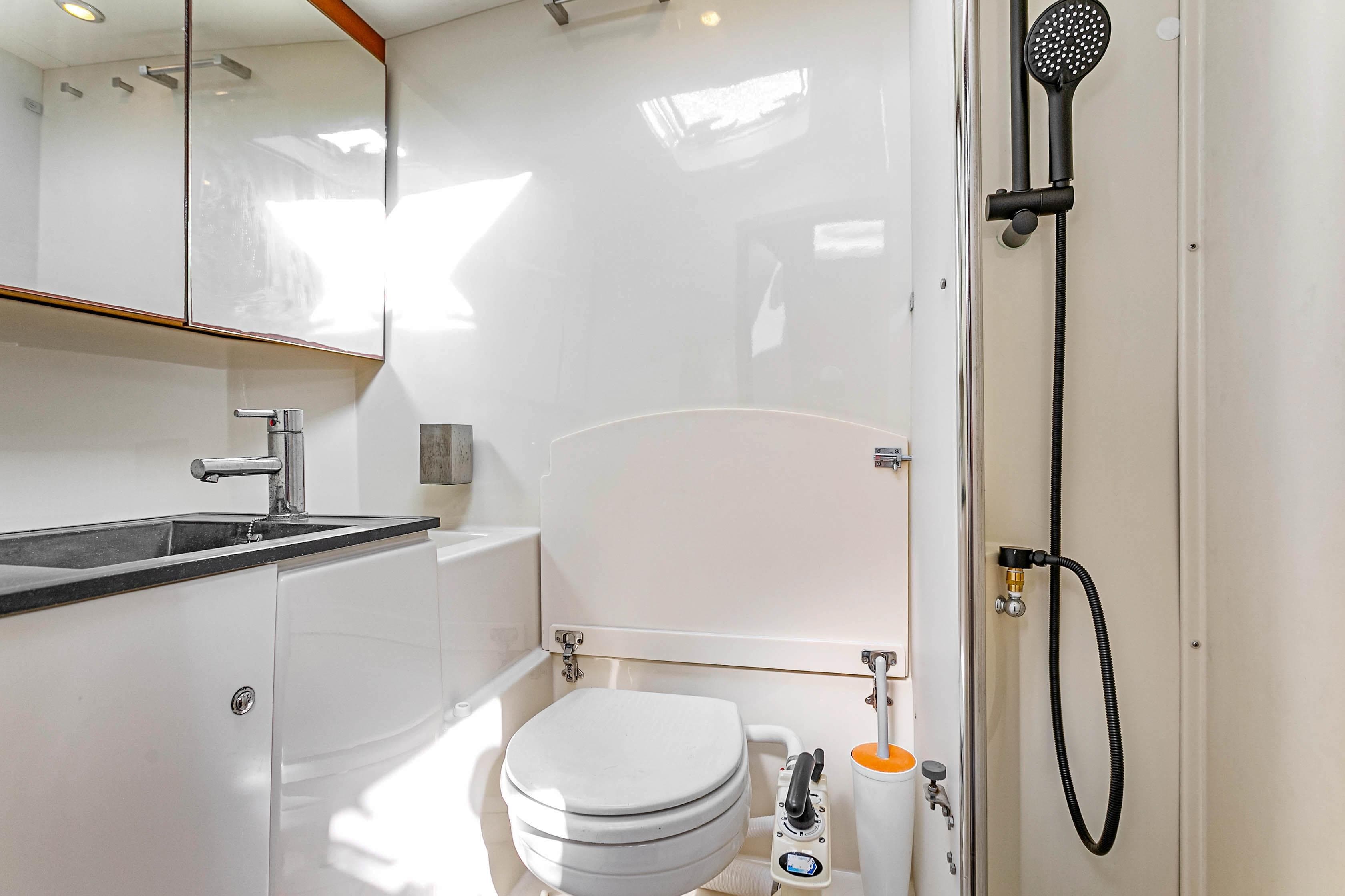 Modern bathroom on 2011 Dufour 525 Grand Large yacht with sleek fixtures and shower.