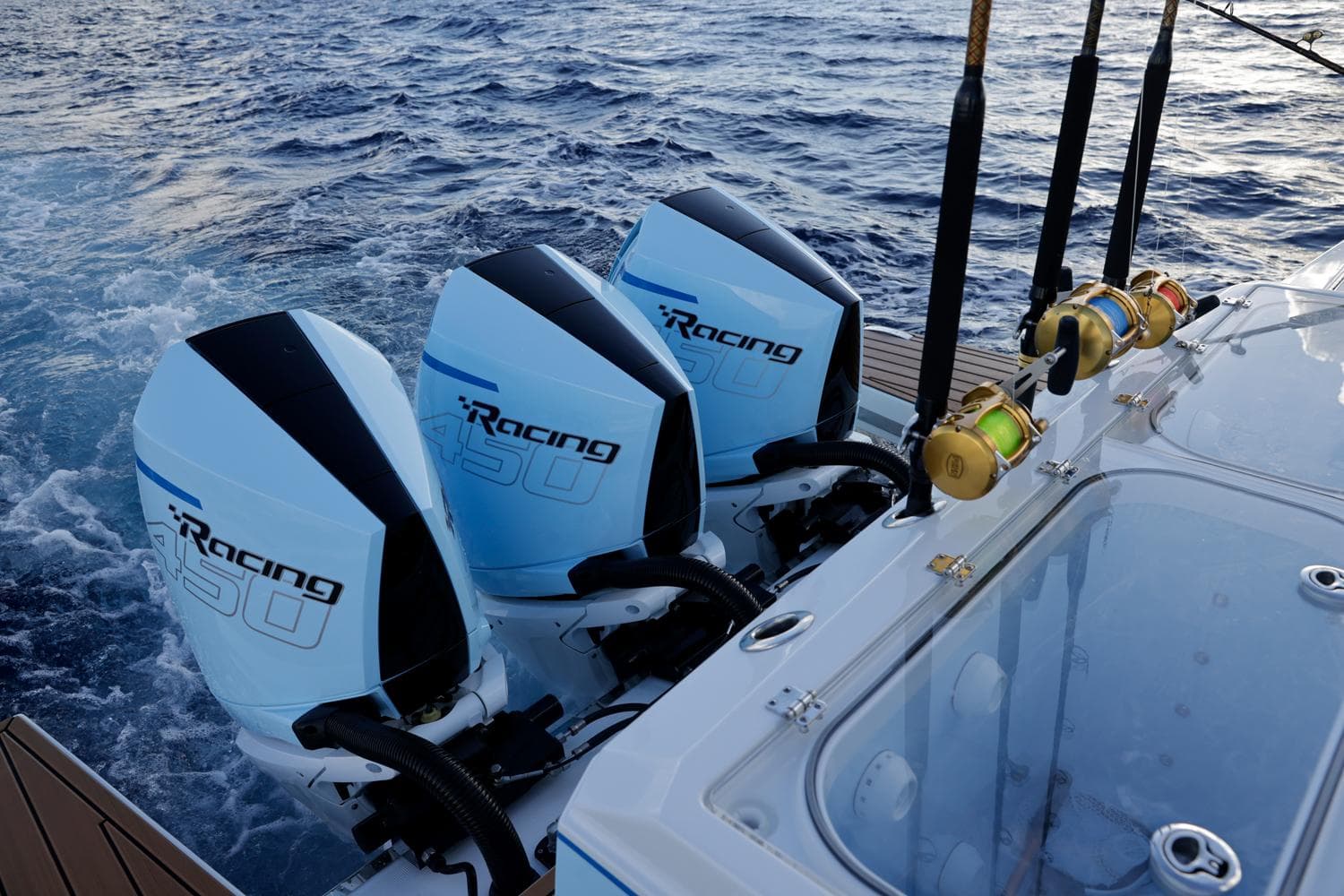 2023 Formula 387 Center Console Fish with triple outboard engines on the ocean.