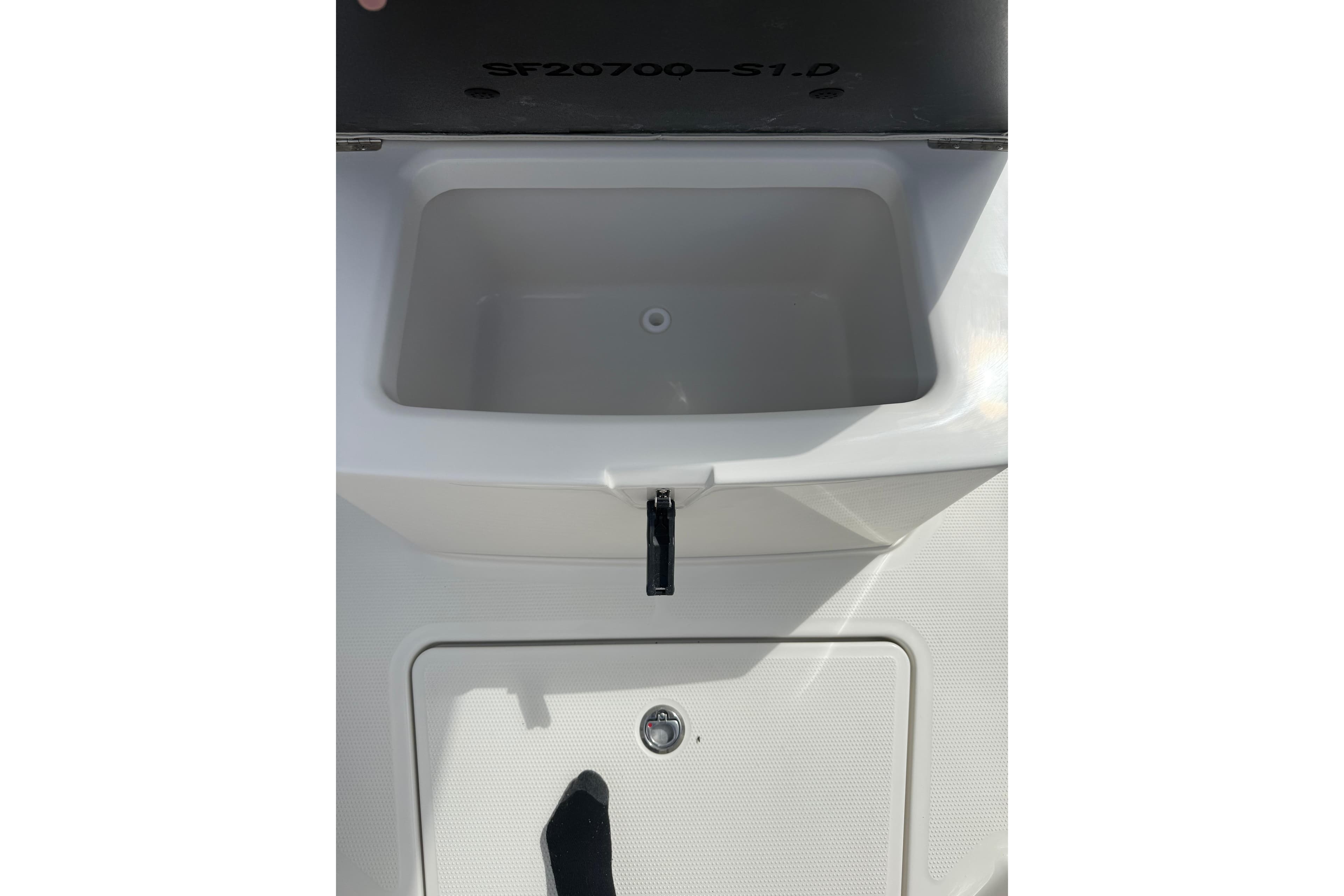 Livewell compartment on 2026 Sailfish 272 CC boat, featuring a sleek design.