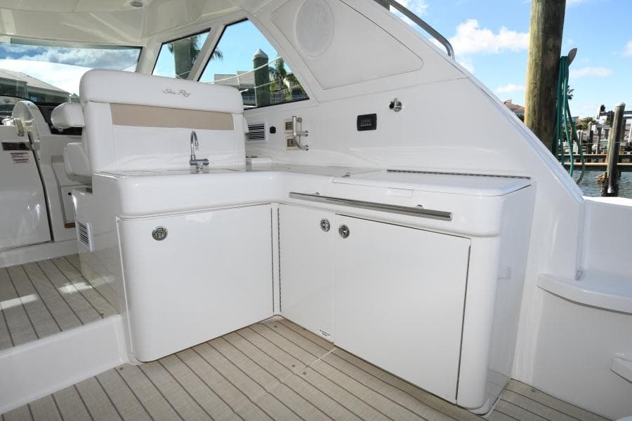 2010 Sea Ray 450 Sundancer yacht interior with sleek white cabinetry and modern design.