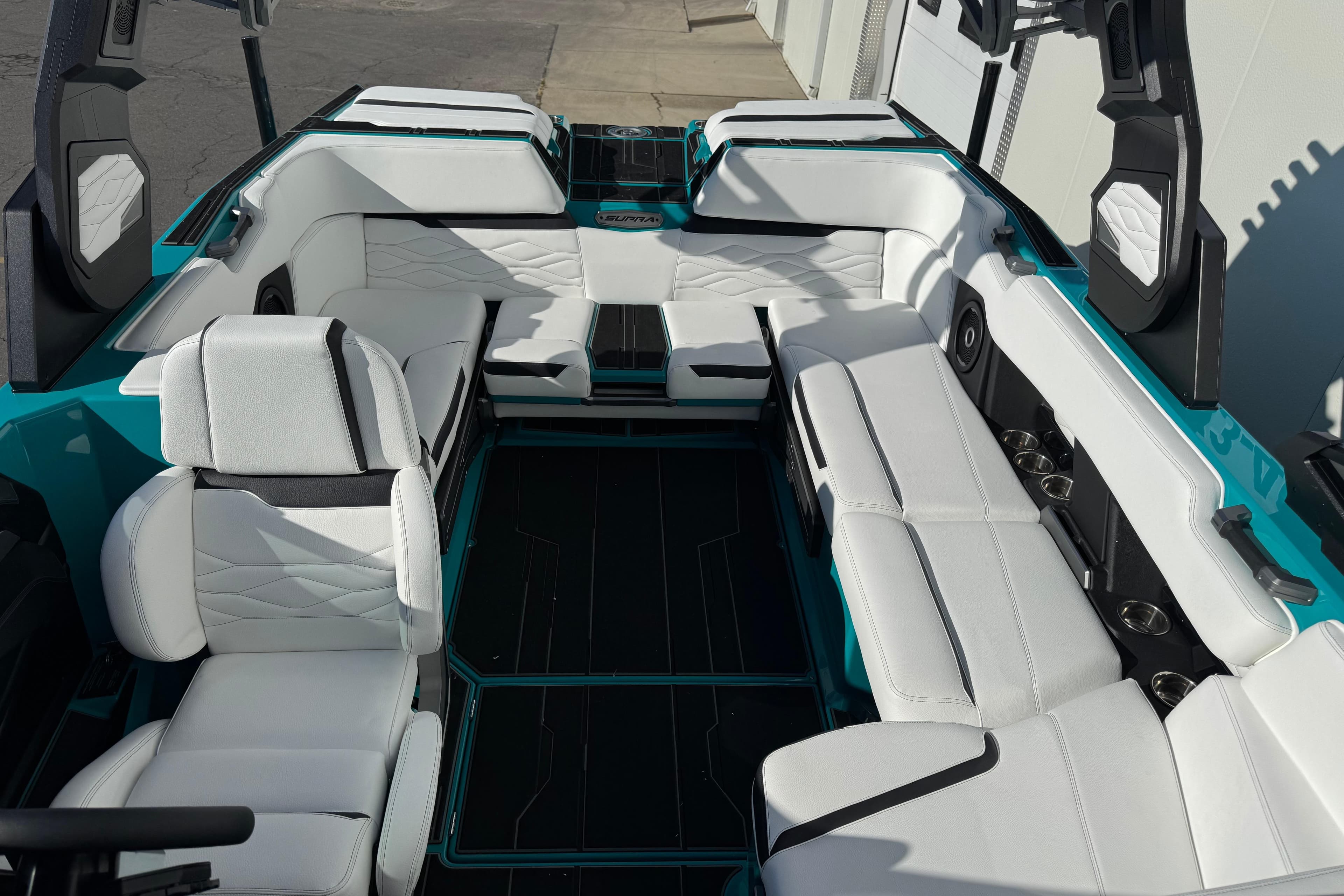 2026 Supra SA 575 boat interior with luxurious white seating and modern design.
