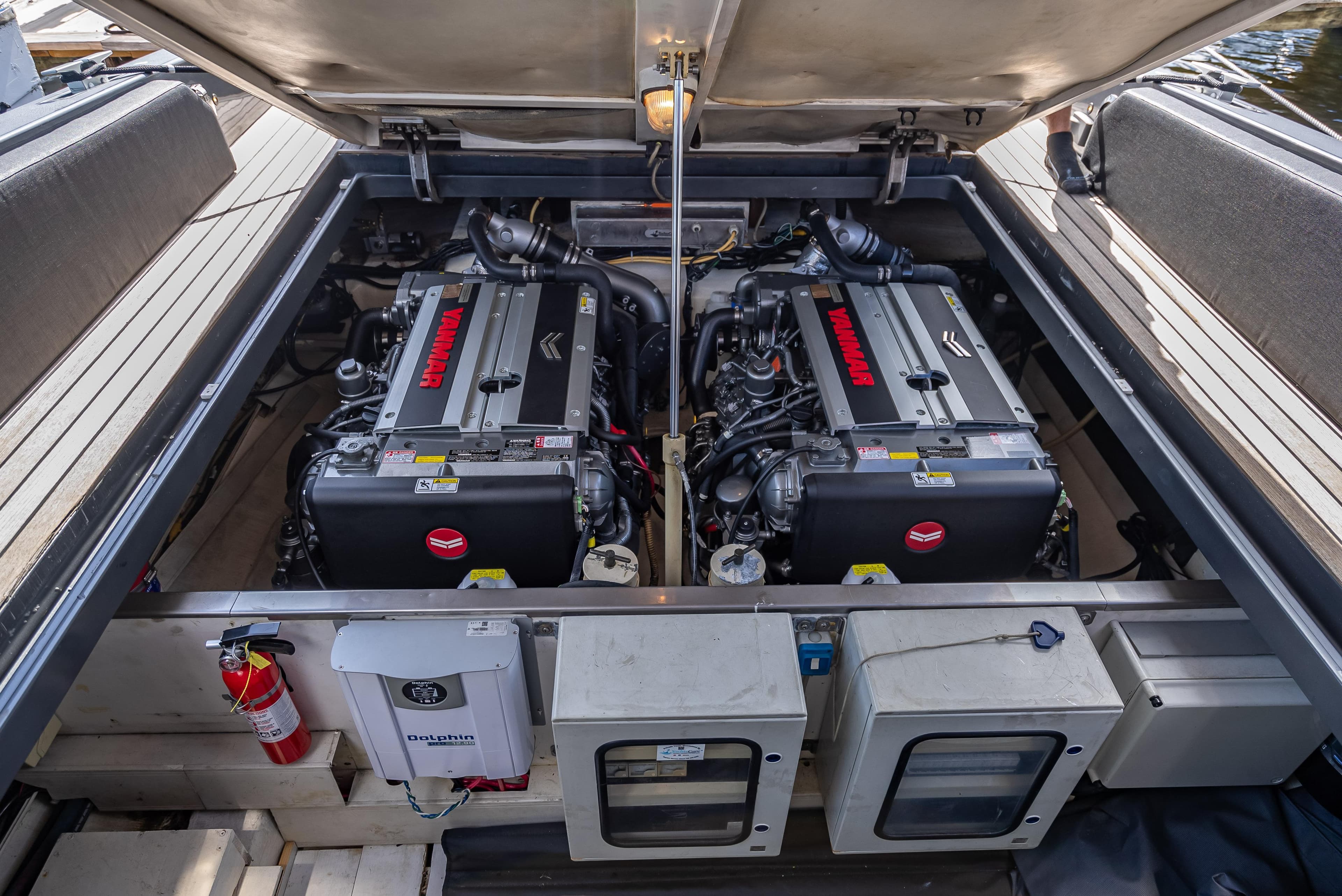 Engine compartment of a 2012 Wally 43 boat, featuring twin engines and safety equipment.