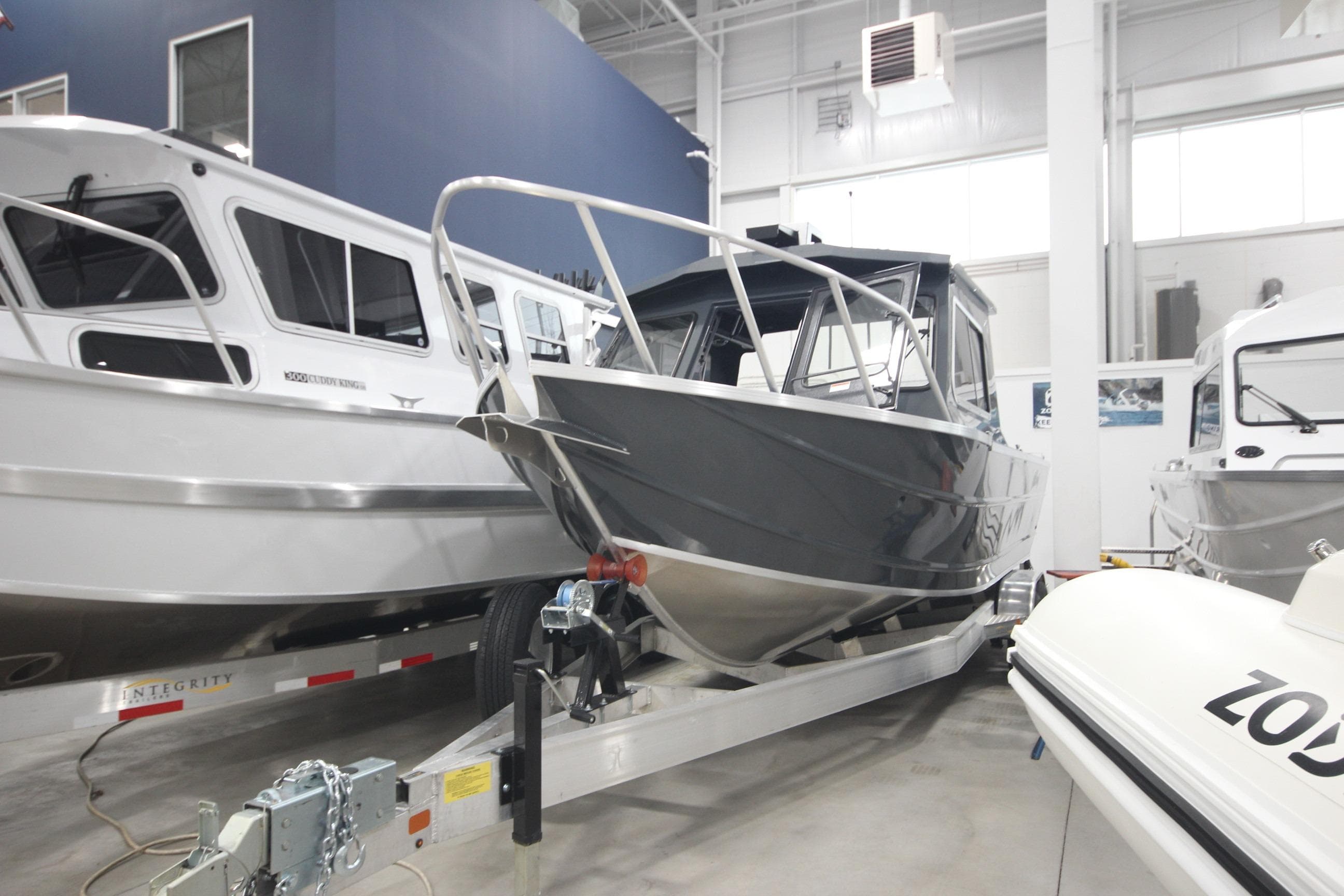 2026 Weldcraft 240 Ocean King F300XCB boat displayed in showroom.
