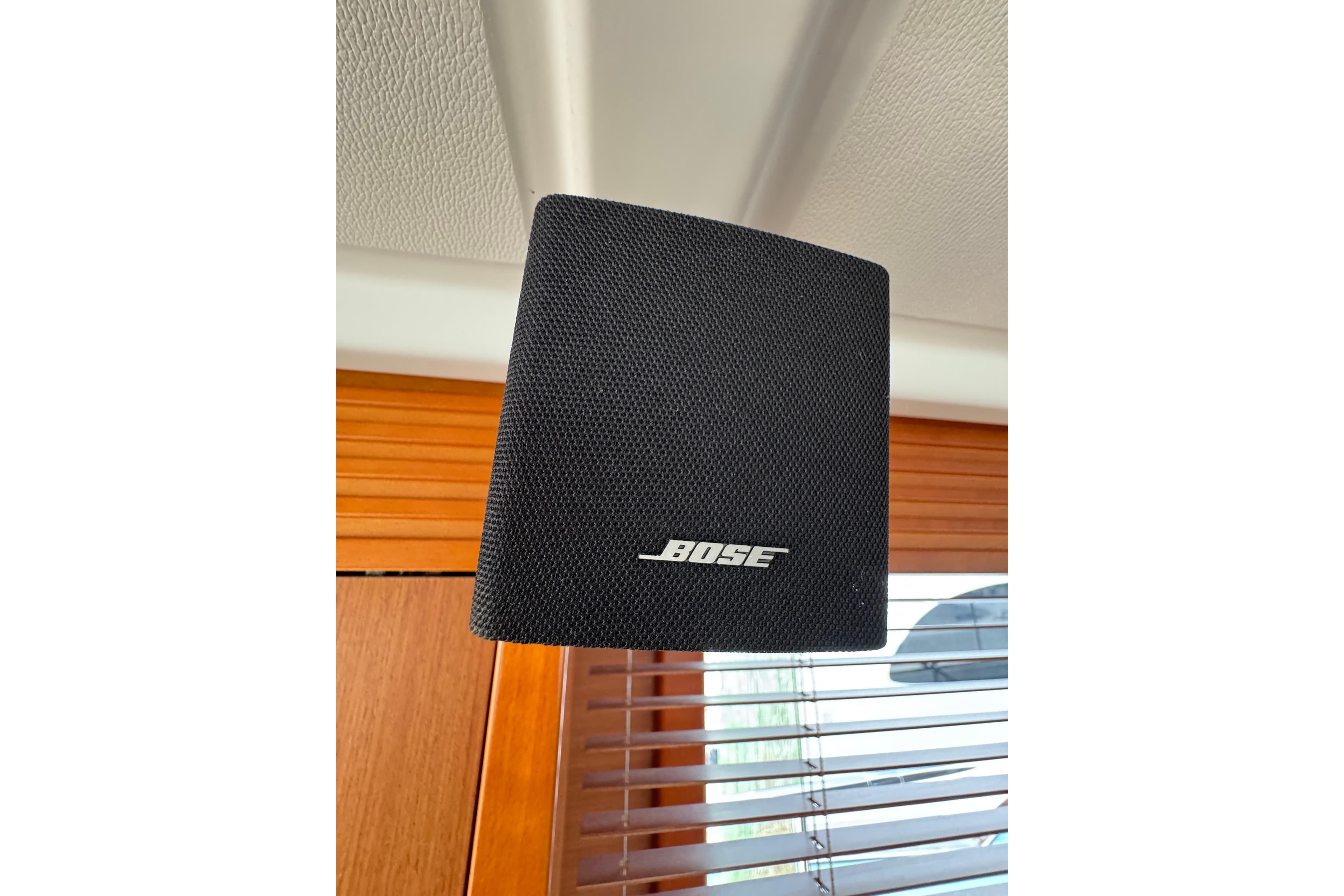 Bose speaker inside 2014 Beneteau Swift Trawler 44, mounted near wooden blinds.